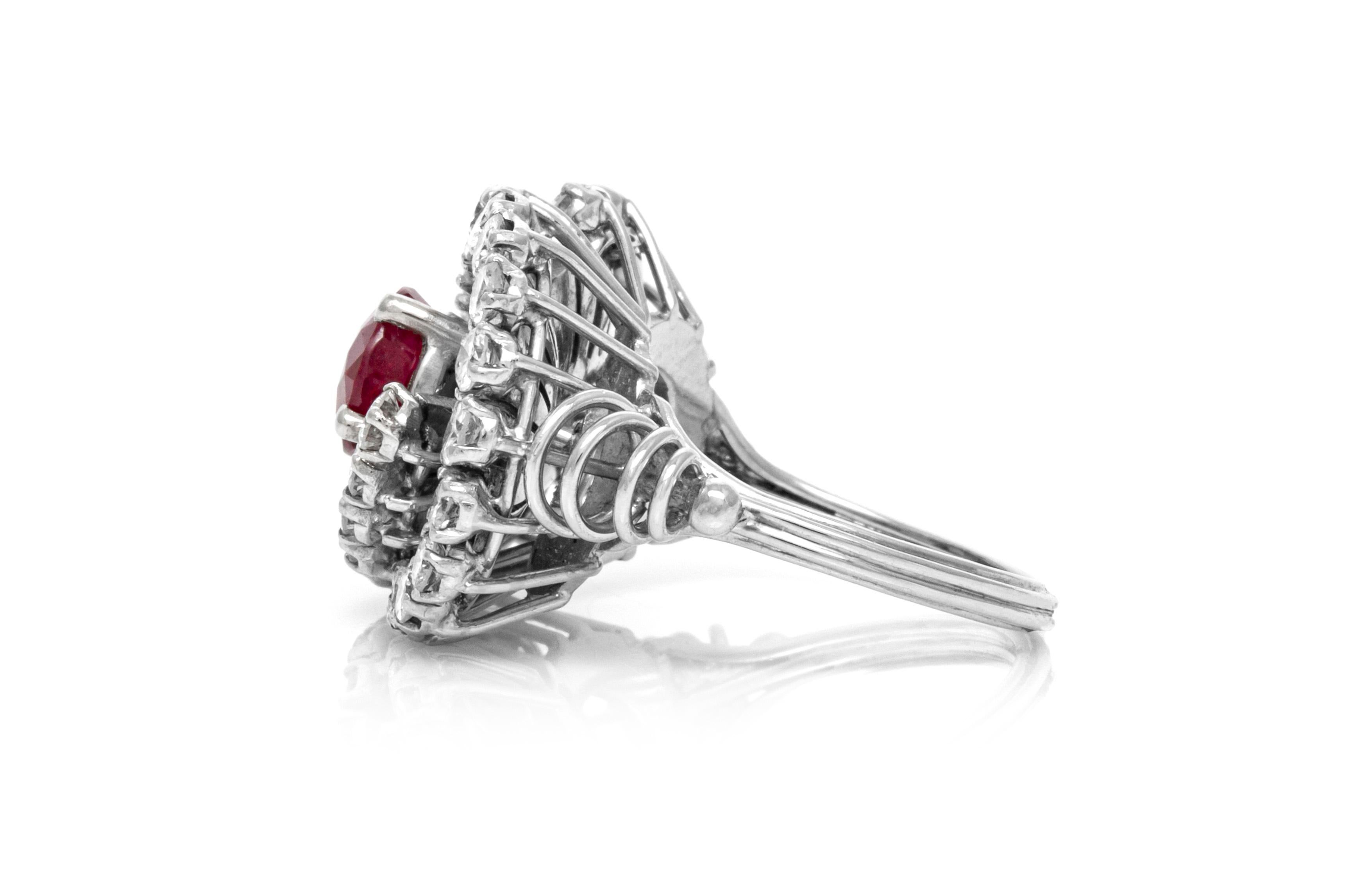 Cocktail ring finely crafted in platinum with center ruby weighing approximately 1.77 carat, and surrounding diamonds weighing approximately 2.00 carat.
The ring size is 6.5 US and 54 EU.
Circa 1950's