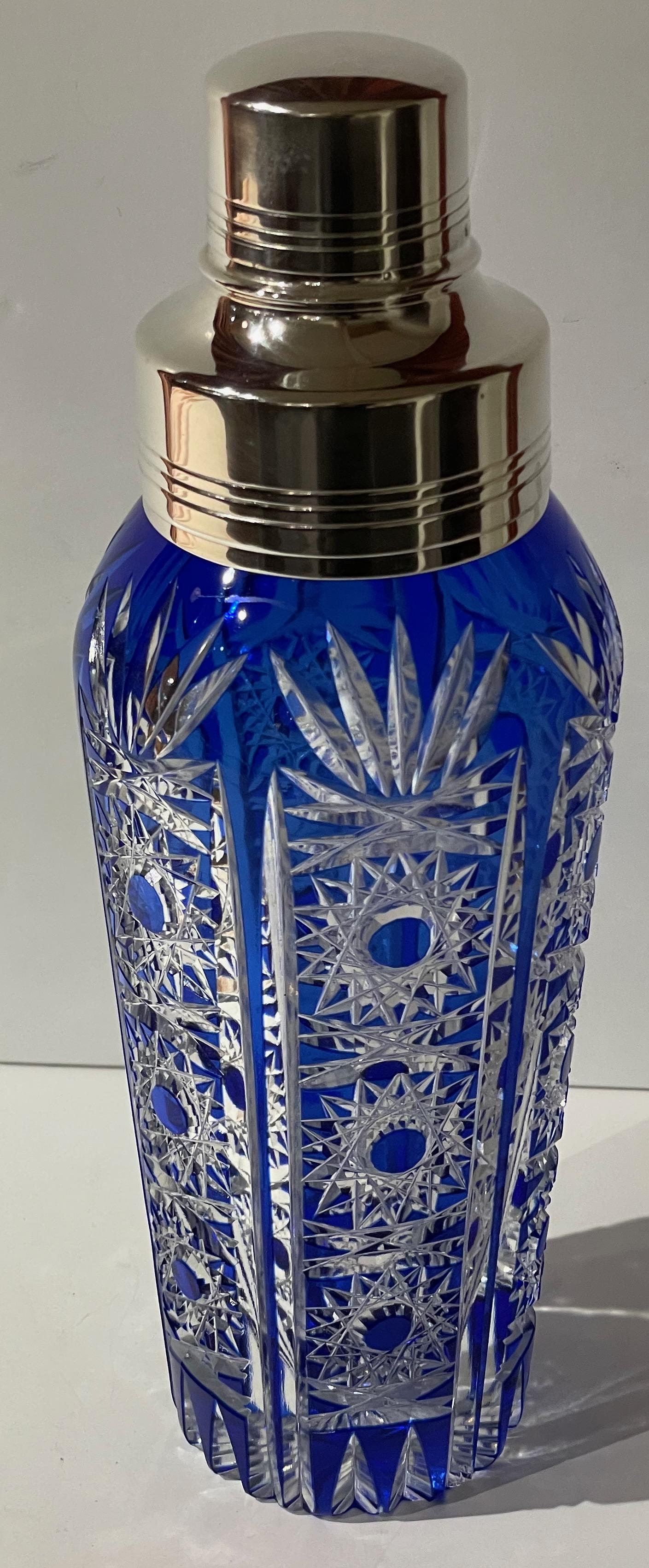 Cocktail Shaker Martini Etched Carved Blue Glass Shaker. Large size and fine details with deeply etched treatment. Possibly of Czech origin. Very well made and of course will make a perfect cocktail.
 
Look closely at all the details from the carved