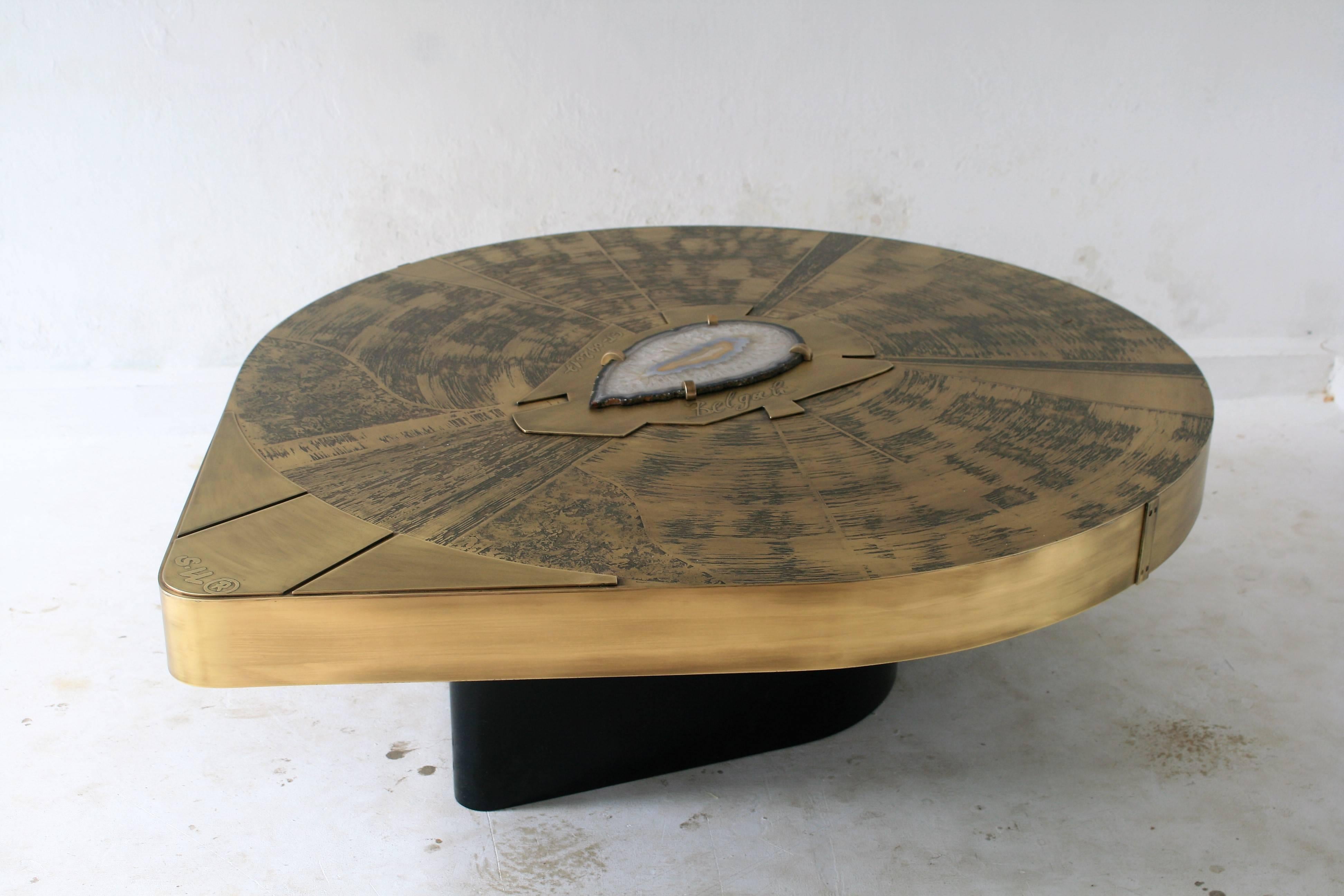 Belgali is a Belgian producer of brass handmade furniture. Mostly acid etched designs, finished with high quality rare semi precious gems. 

The tables can be made to order, each have a slice of agate. They are available for production in acid