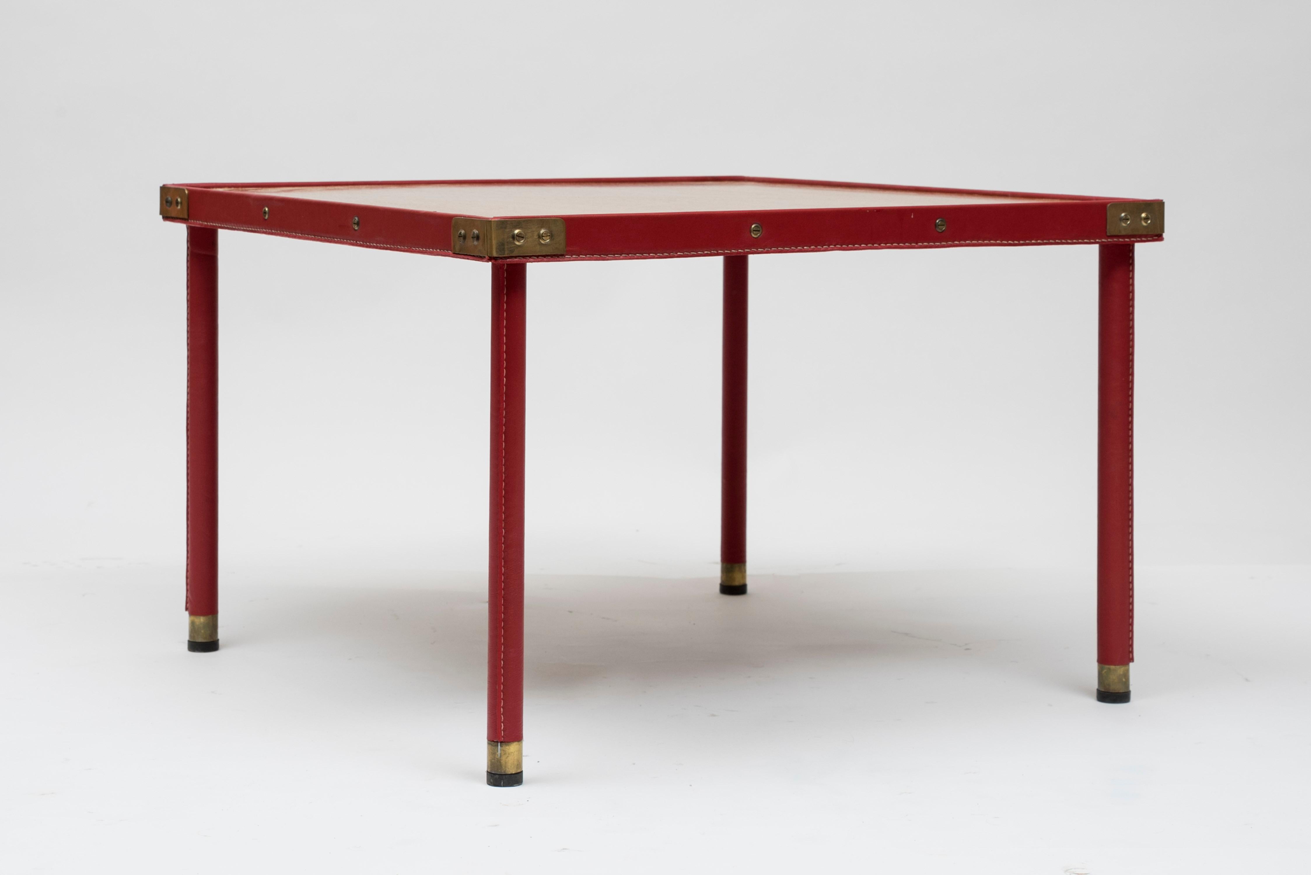 Cocktail table in stitched leather by Jacques Adnet
Oak top
Great shape
France,
1950s.