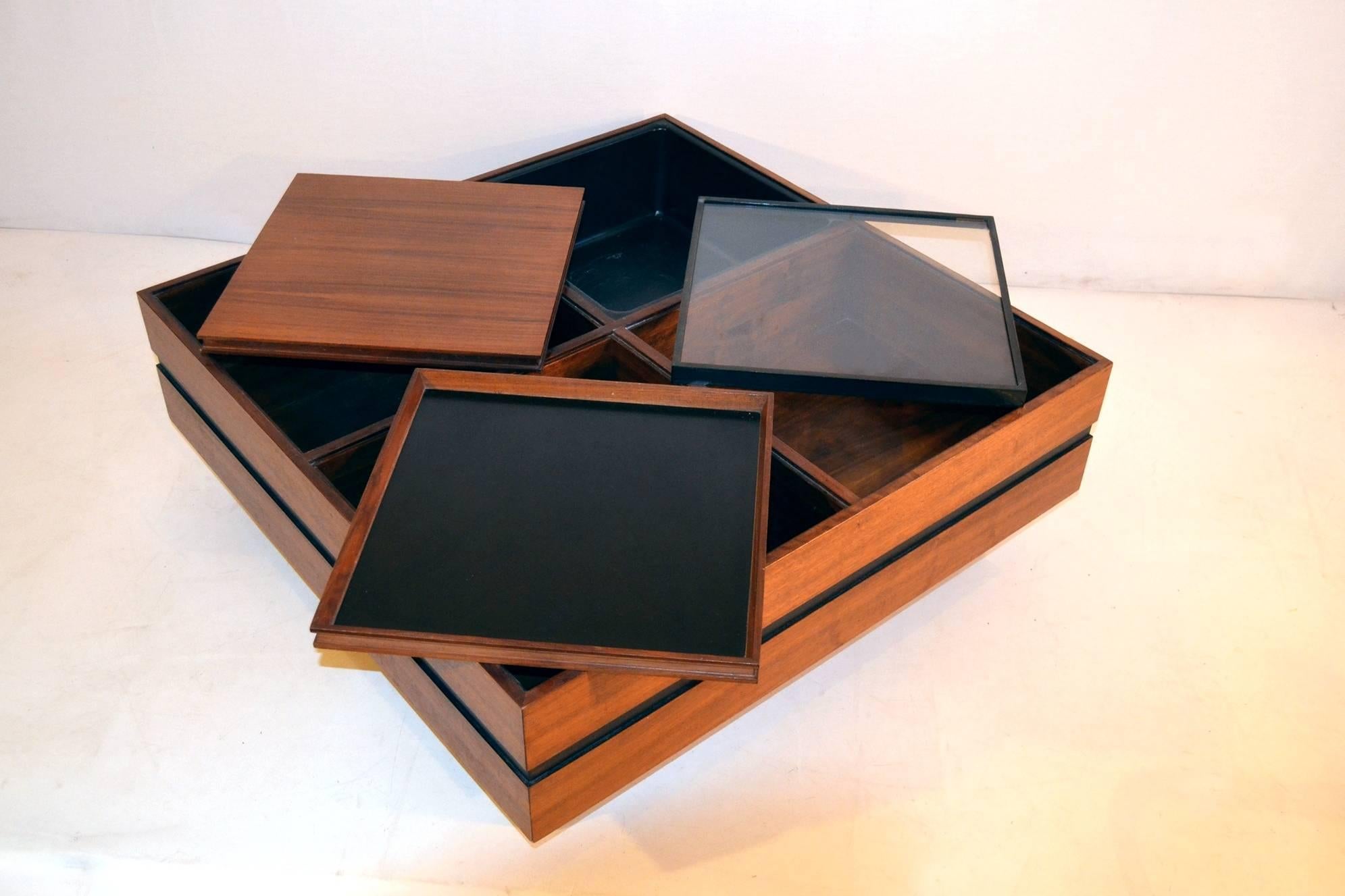 Architectural cocktail tables with four square elements each. The tables consist of a one flower pot, one glass top, one wood top and one tray top. The base of the table has a horizontal line that divides upper and lower half and sits on four square