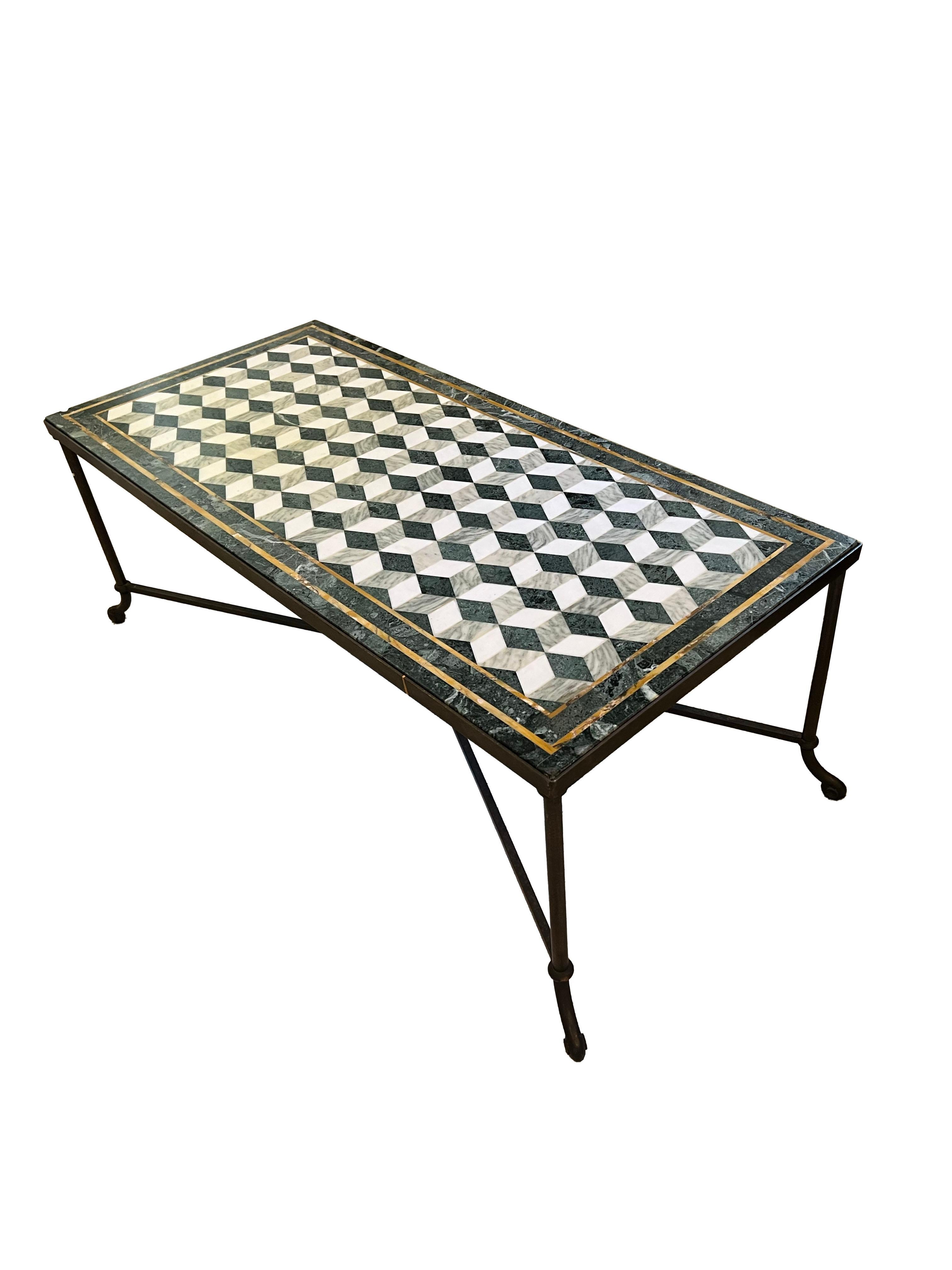 A stunning cocktail table, a statement piece destined to become the centerpiece of any room. Its surface is adorned with an exquisite geometric patterned marble top, where the interplay of green, gray, white, and gold hues creates a mesmerizing