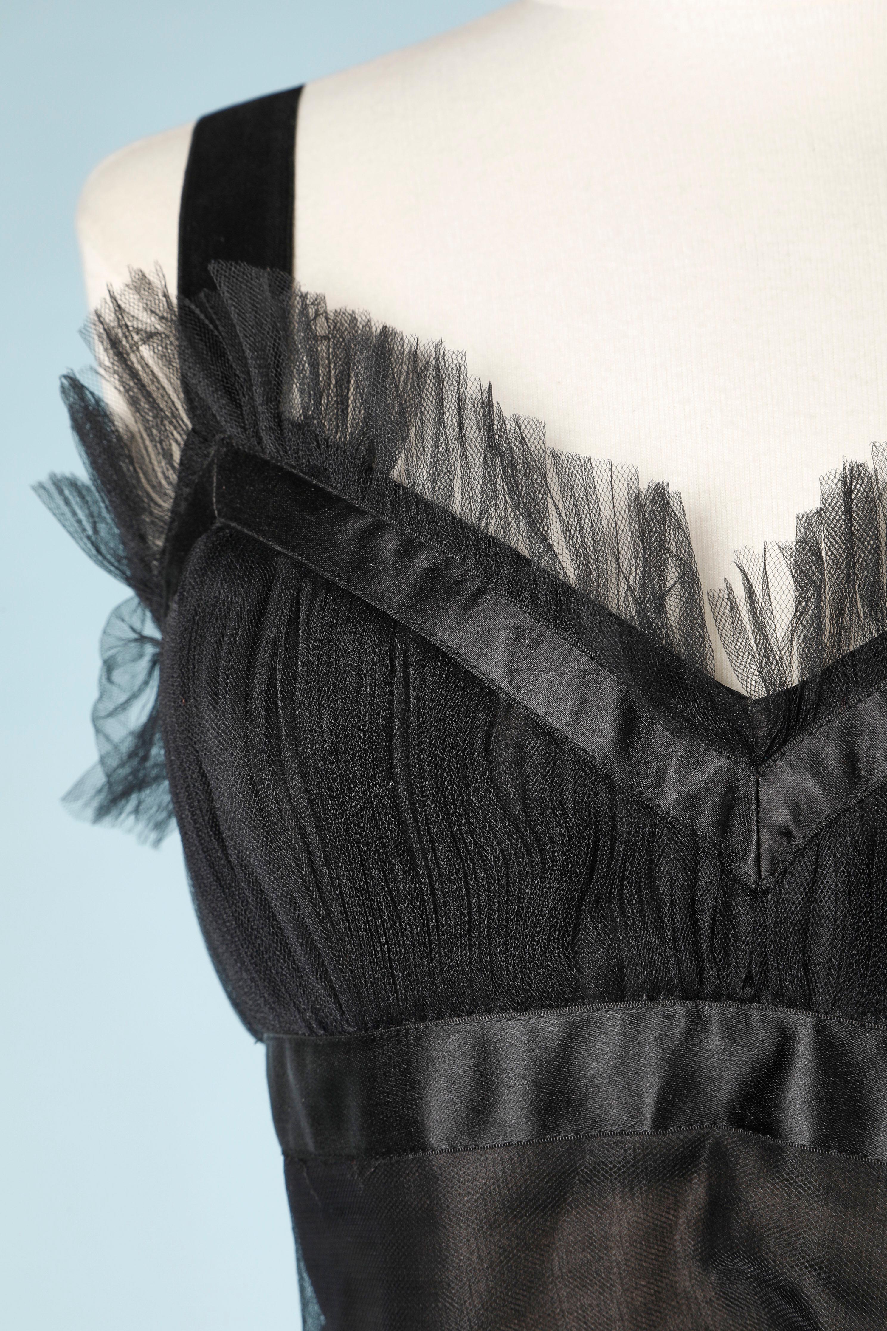 Cocktail top and skirt in black plated tulle and ruffle. Wired bra inside the top. 
Weight (lead) inside the skirt hem 
SIZE S