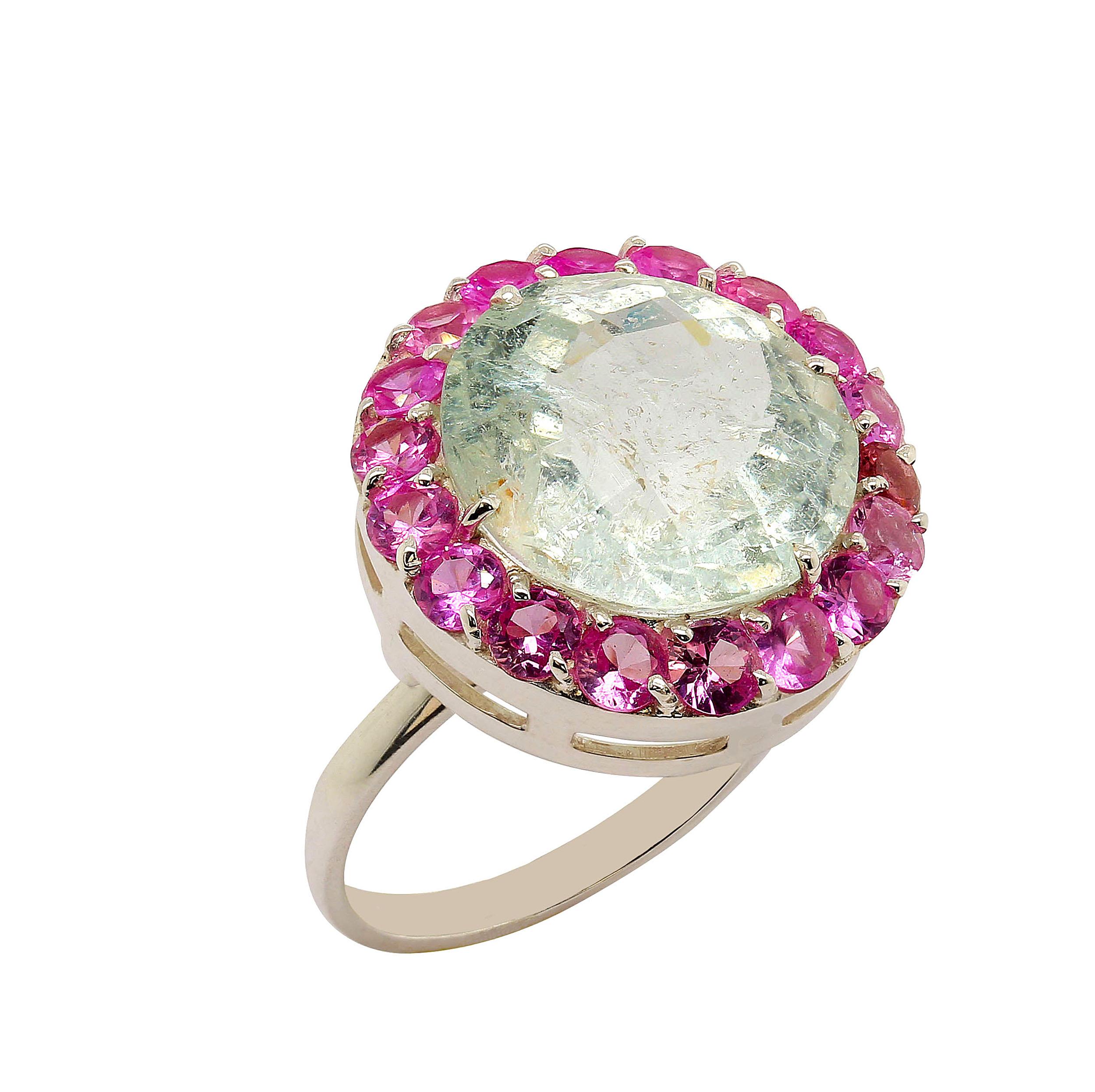 Pink and Green is the perfect color conbination especially when it's Pink Sapphire surrounding Green Beryl. This lovely round Green Beryl has a checkerboard table and lots of inclusions to reflect the light. Hot Pink Sapphires set off the cooler