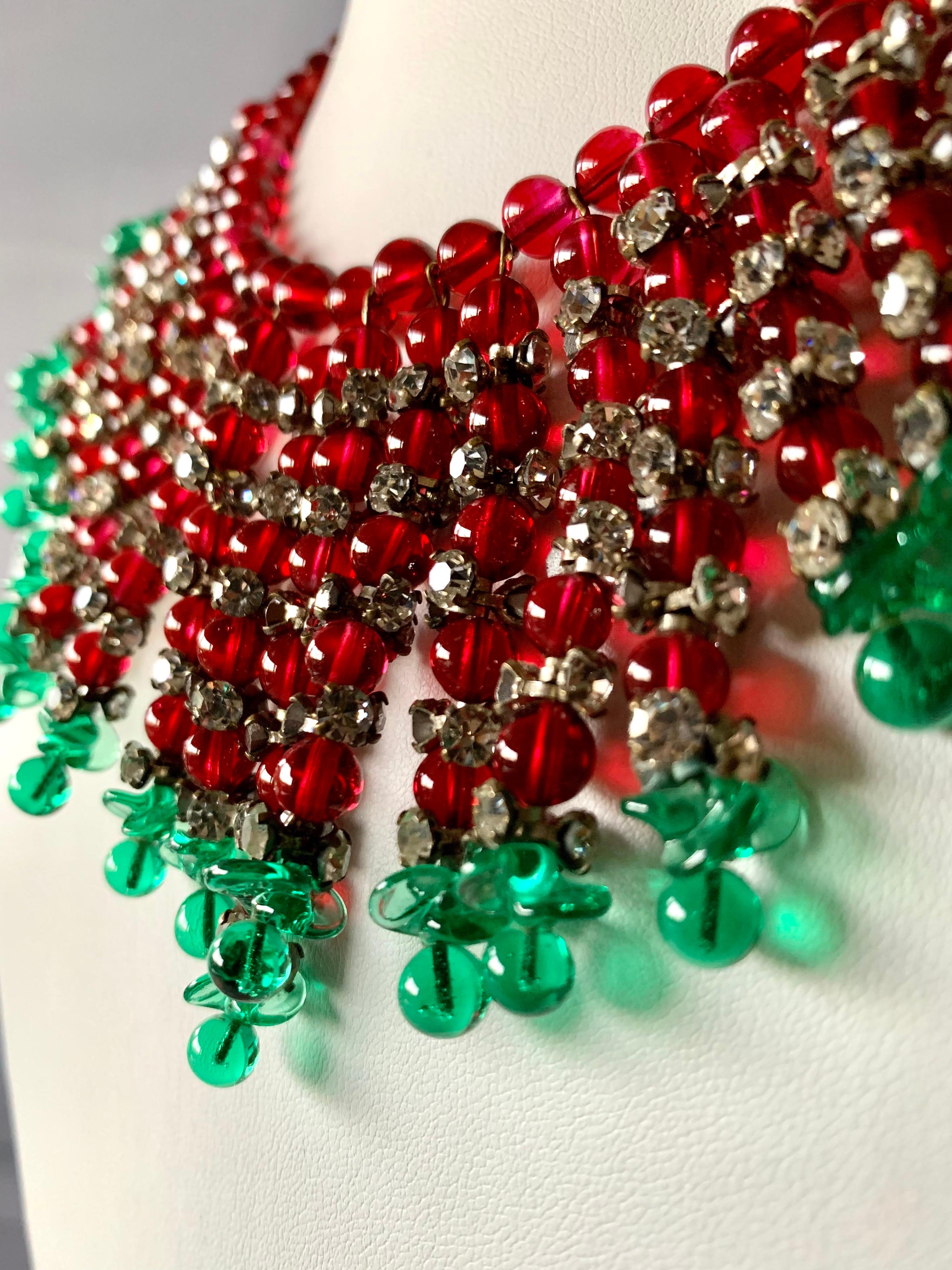  Exquisite Coco Chanel statement necklace by Maison Gripoix featuring an Art Deco fringe design, beaded in green and red glass beads which are accented by clear rhinestones, made in France circa 1930s - 1950s. The necklace is a great example of Coco