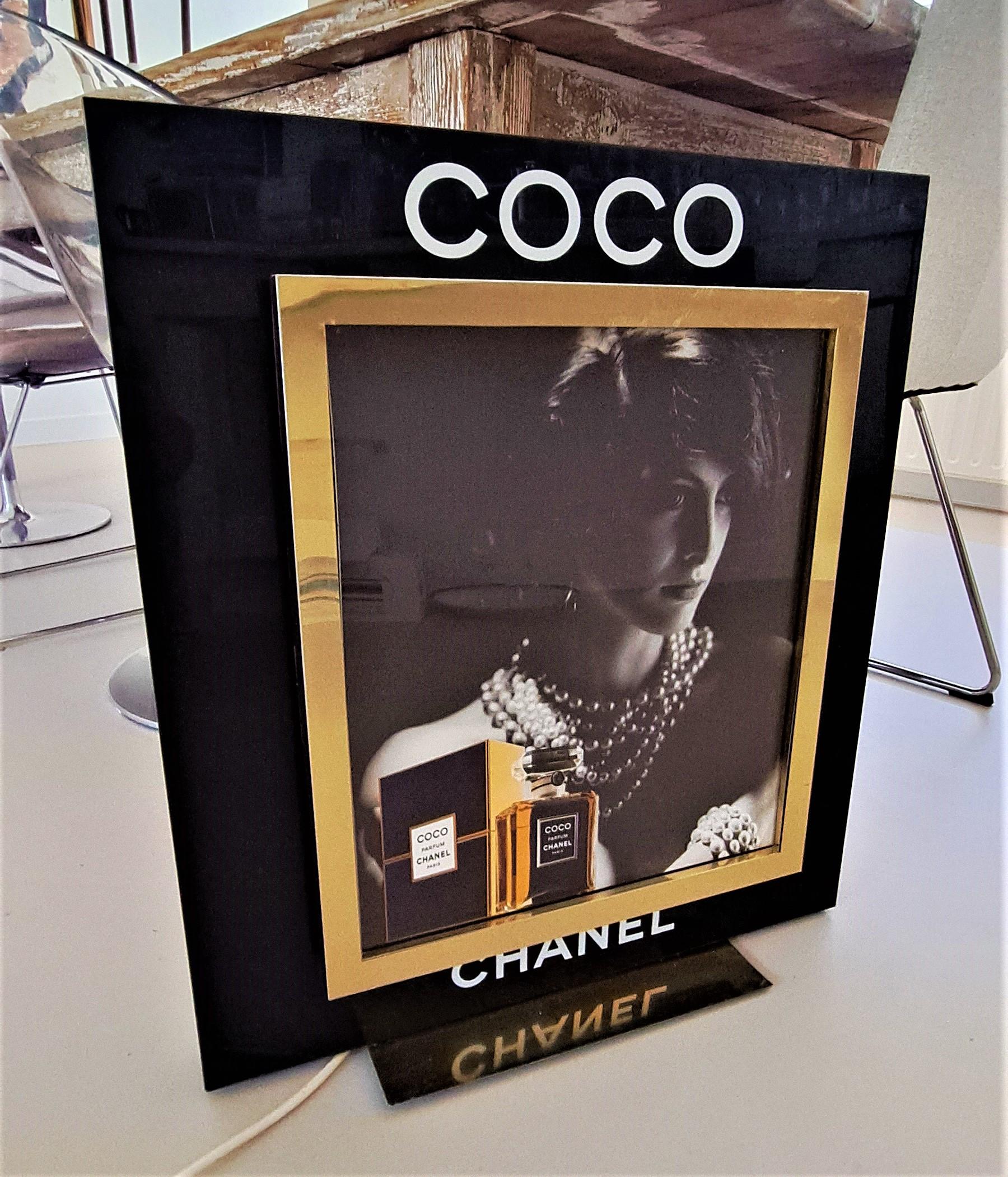 Very Rare Vintage 1988 French Advertisement  for Coco Chanel with Ines de La Fressange.  Black Acrylic and brass, electrified with an internal light (EU, but can be rewired) 120V. An unique piece. Could be used for home decor. 
Ines de La Fressange,