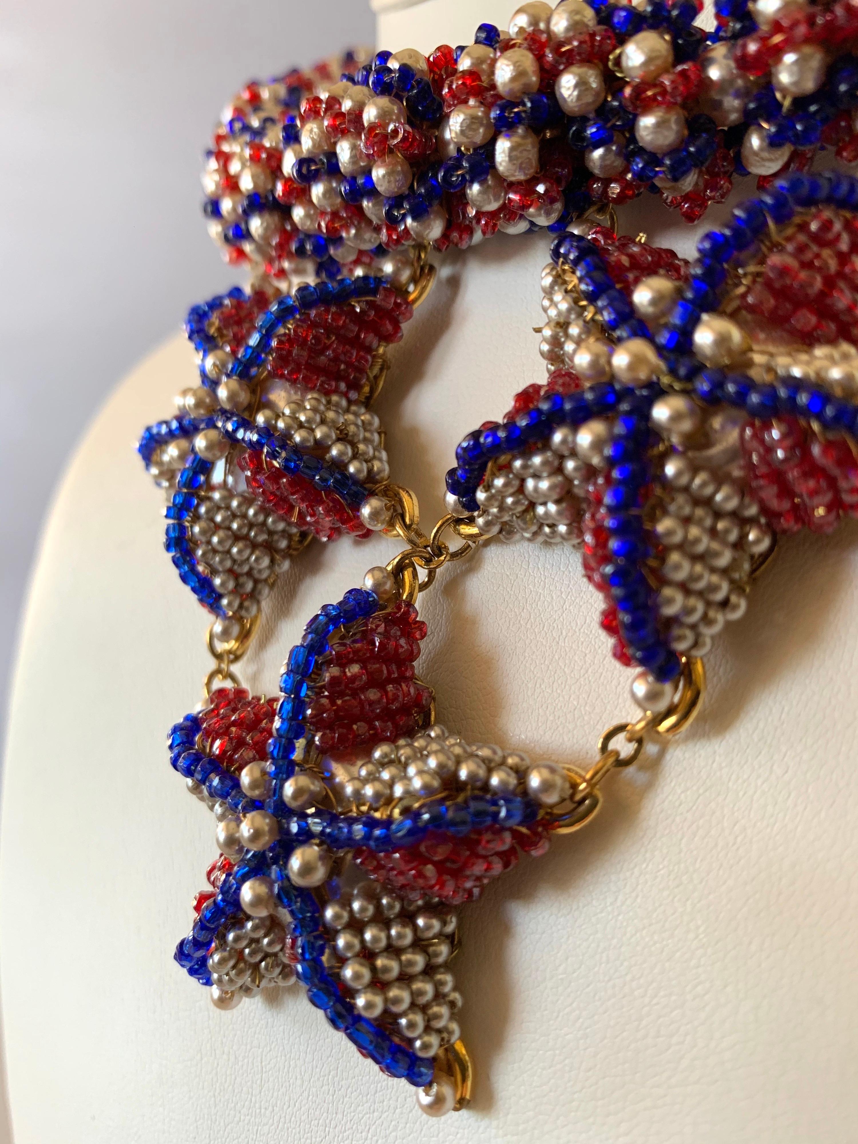 Monumental haute couture beaded bib statement necklace, by William de Lillo for Coco Chanel haute couture. Comprised out of gilt metal dore (14k plate) the necklace features a thick beaded chain in red, white, and blue which is accented by creamy