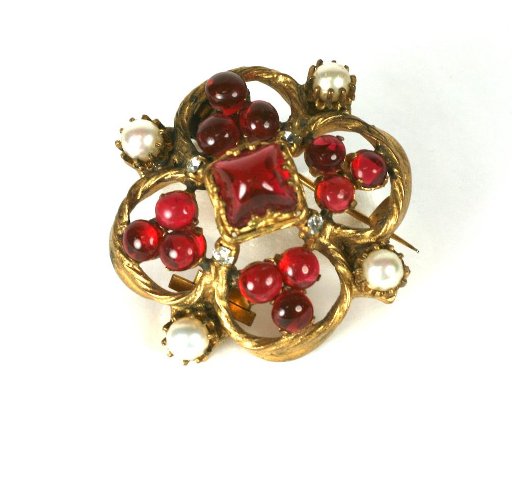 Coco Chanel Medieval style brooch, quatrefoil in form of ruby pate de verre with multiple  handmade faux pearls. This style of brooch was one of Chanel's 