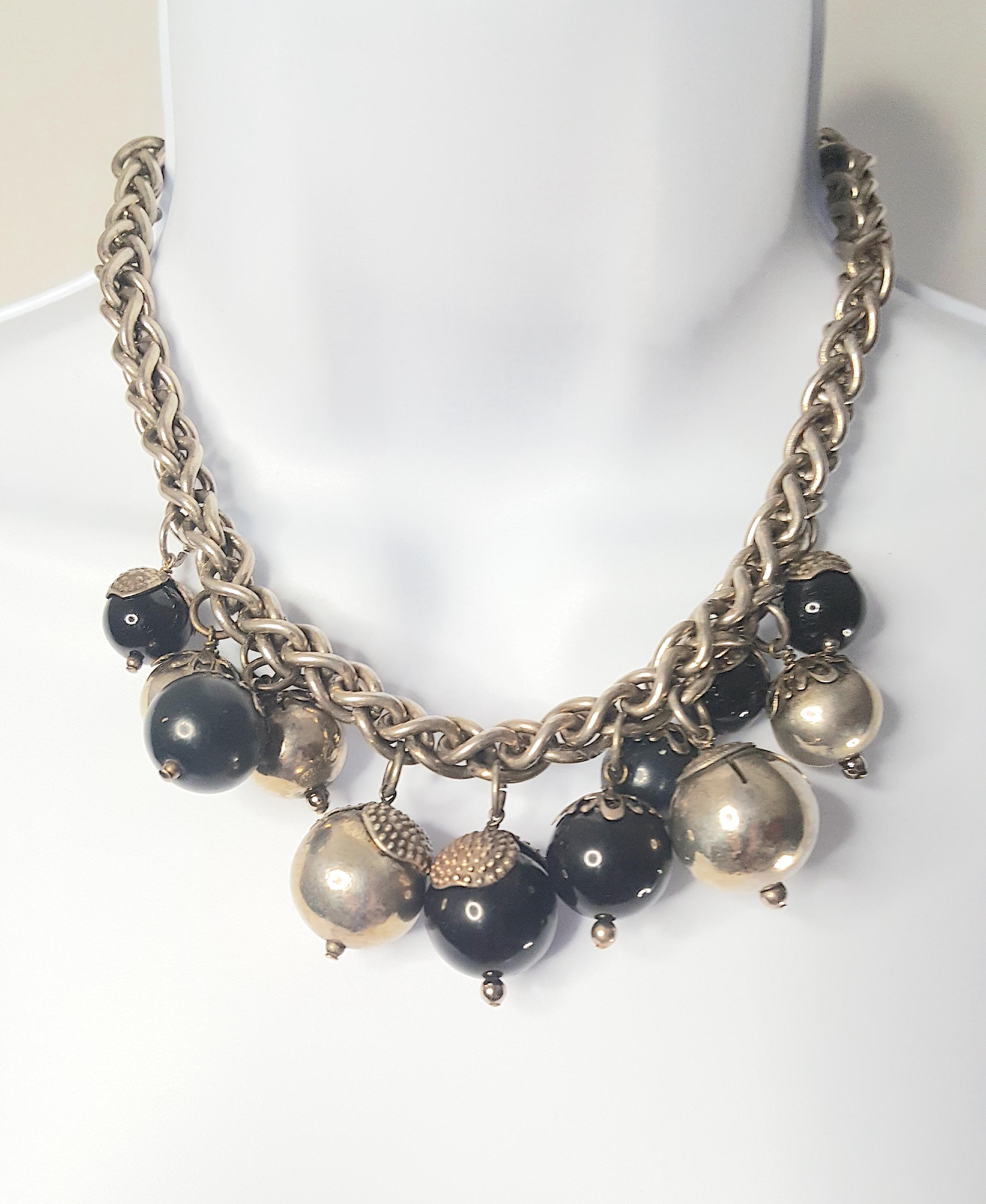 Featuring 12 large patinated pearlescent charms distinctly handcrafted by Parisian Louis Rousselet--the master glass-and-metal-ornament parurier for French couture fashion houses since 1920--this heavy silver chain necklace is made in the unique