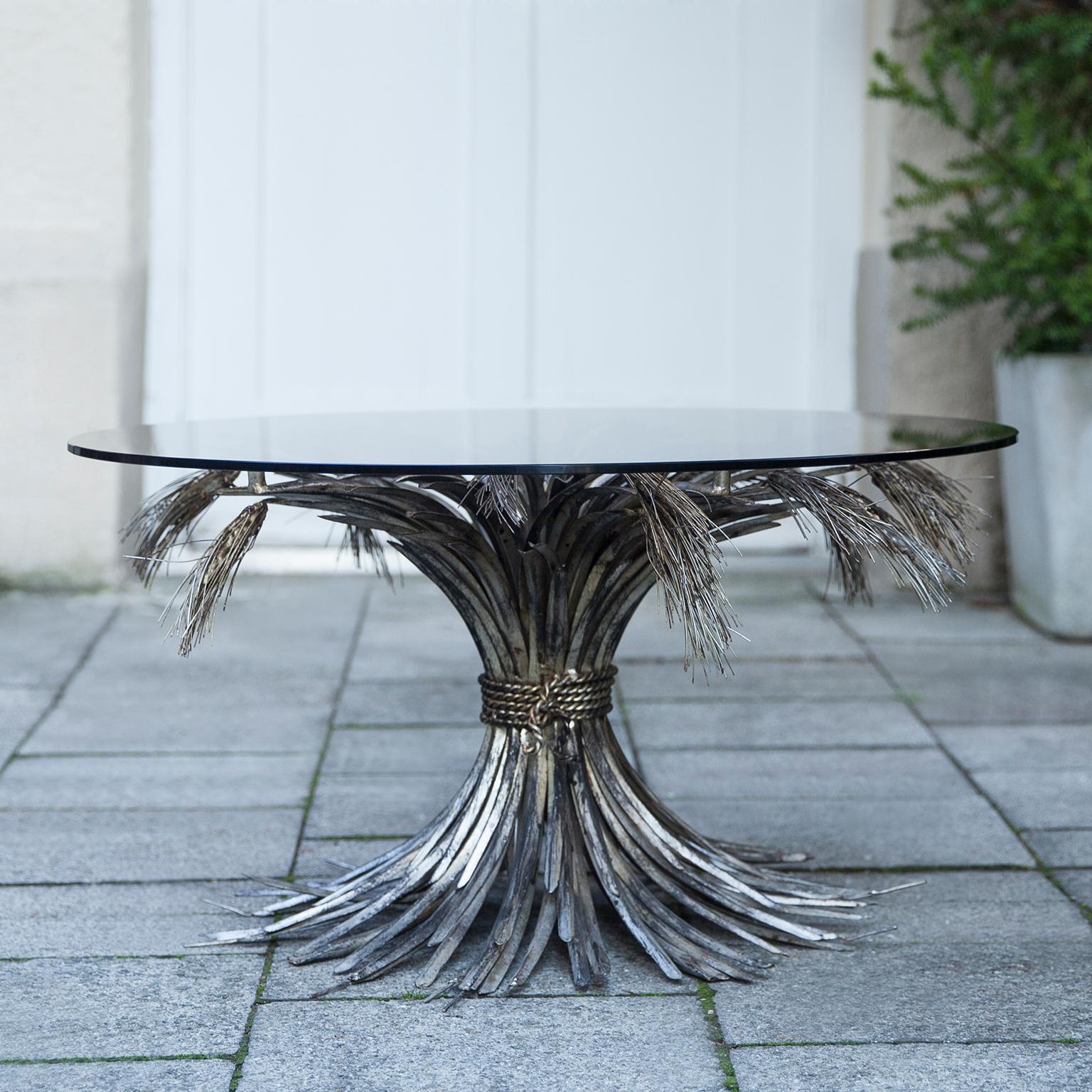 A truly eye-catching original silver-plated gilt metal coffee table. Fashioned in the shape of a wheat sheaf bound by string and a perfect round glass top. This table is a really old piece in original shape with the perfect height to be used as a