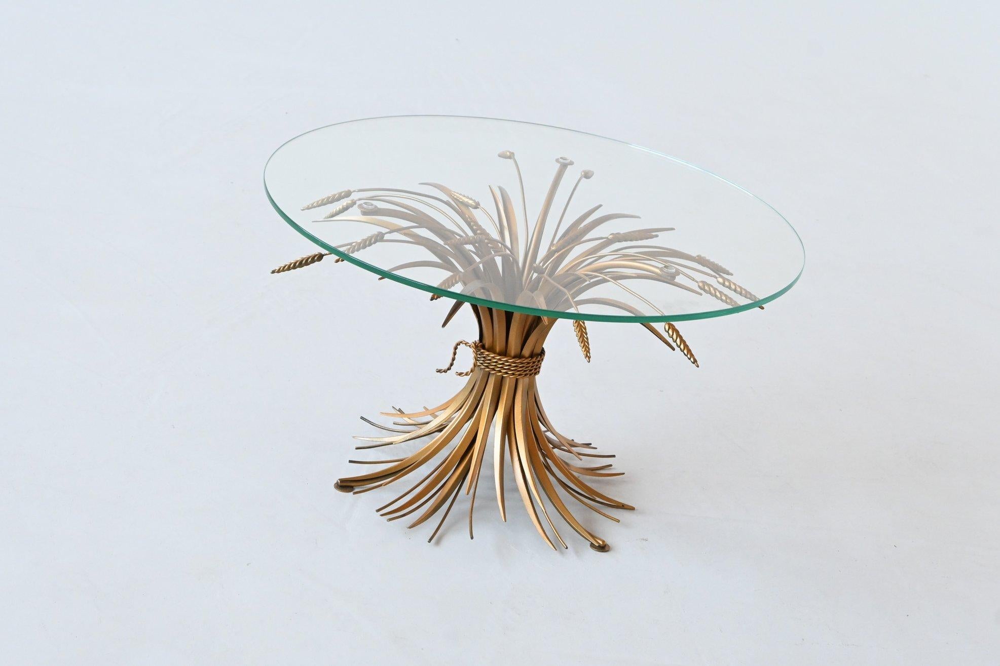 Beautiful “Sheaf of Wheat” coffee table designed in the style of Coco Chanel, France 1960. Coco Chanel used this type of coffee table in her legendary Parisian apartment. A very elegant and bespoke piece of furniture. The table is made of gilt wheat