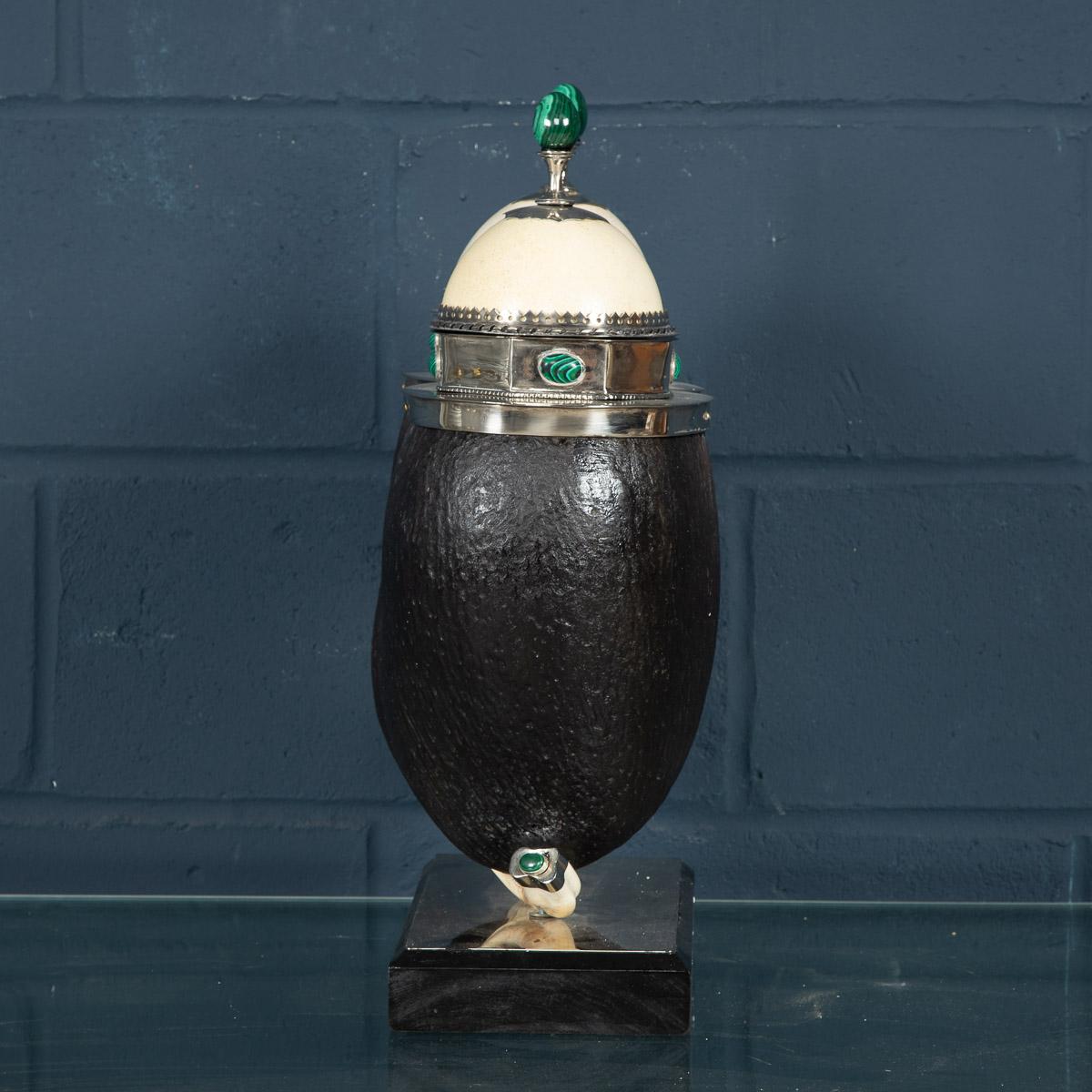 Signed Anthony Redmile, this extremely rare 1970s Coco de Mer Seychelles double coconut box is one of the most unusual and finest examples of the great artist’s work. Silvered mounts, ostrich egg lids, embellished with malachite, cabochons and