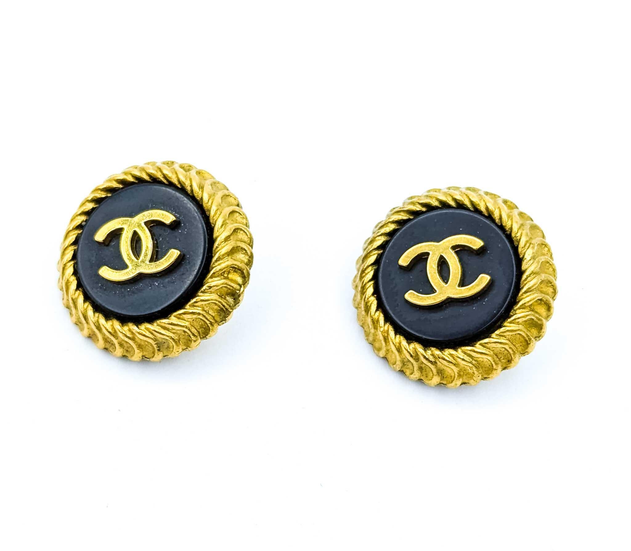 Coco Mark Round CC Black Acrylic Earrings

Discover the timeless elegance of these Vintage Coco Chanel Round CC Black Acrylic Earrings. Crafted in 1995, these exquisite pieces boast of gold-plated brass that perfectly complements the iconic Chanel