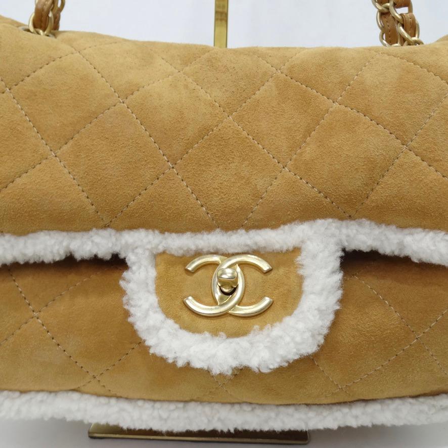 Chanel presents an elevated take on their iconic double flap for this handbag circa Chanel's fall/winter 2022-2023 collection 'Coco Neige' inspired by skiing! This handbag is perfect for any ski bunny longing for the slopes, the quilted brown suede