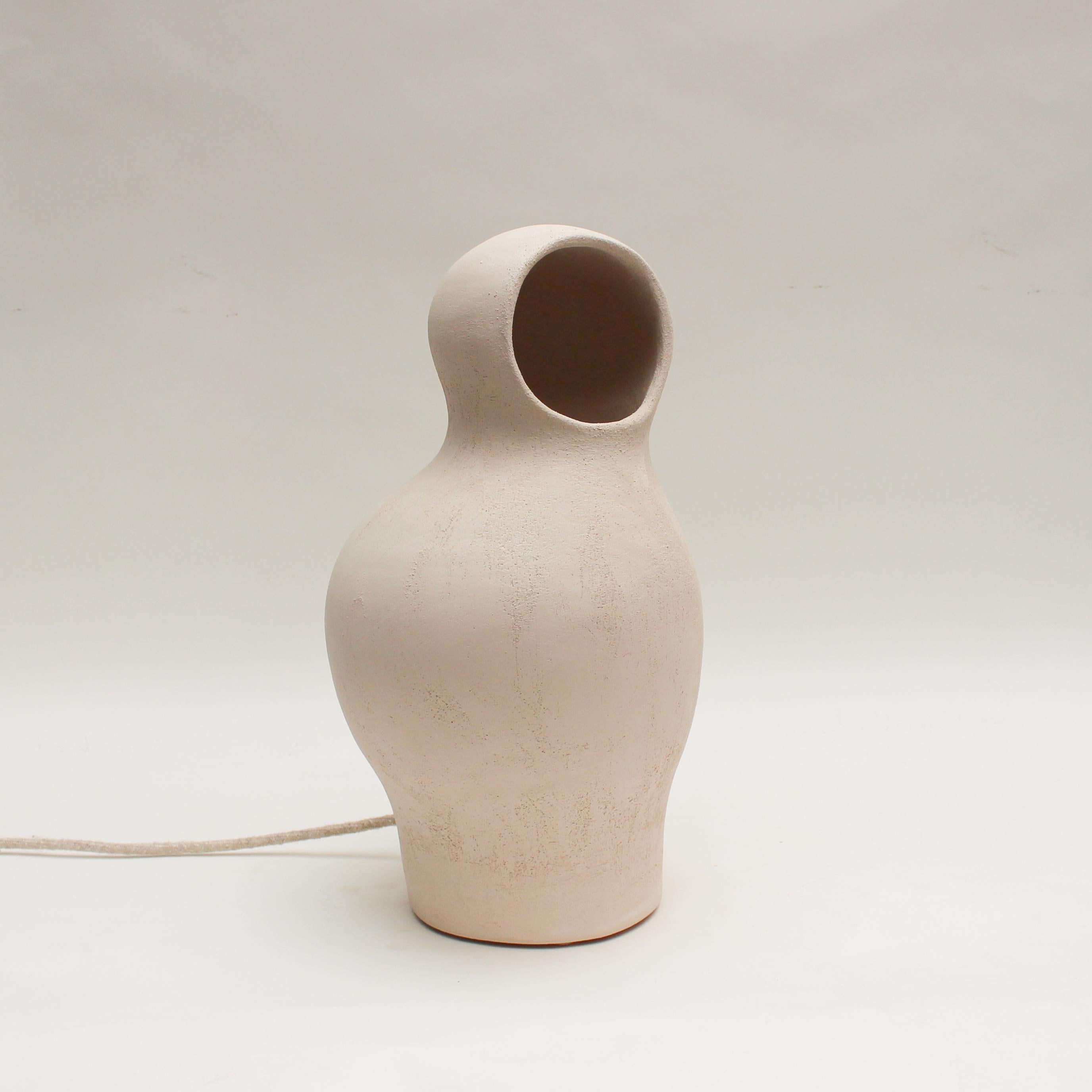 Cocon #3 white stoneware by Elisa Uberti.
Dimensions: high around 35 cm.
Materials: white stoneware.

After fifteen years in fashion, Elisa Uberti decides to take the time to work with these hands and to give birth to new projects.

Designer