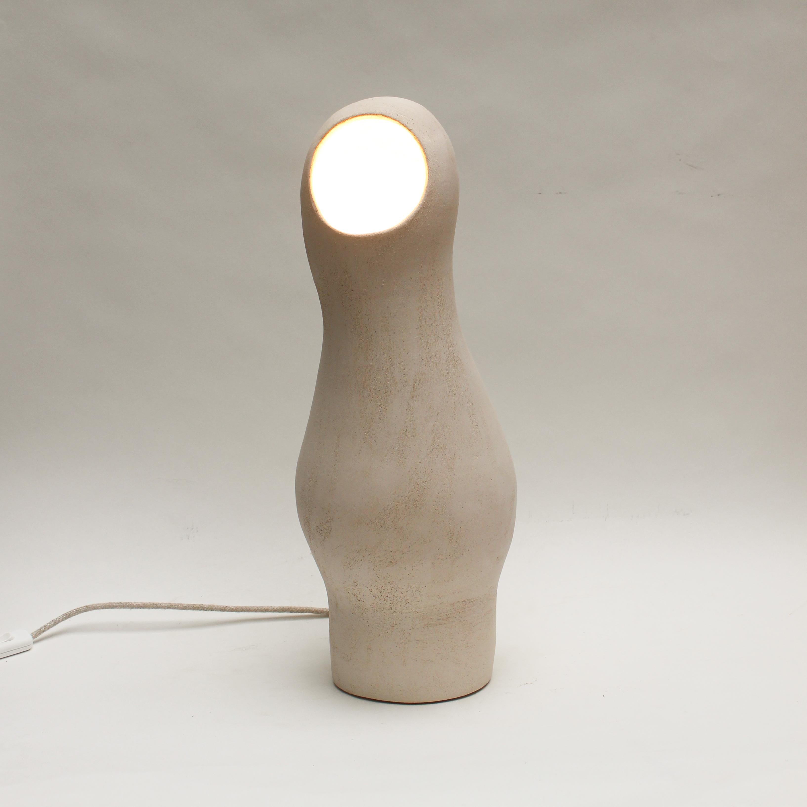 Cocon #4 white stoneware lamp by Elisa Uberti
Dimensions: high around 50cm
Materials: white stoneware

After fifteen years in fashion, Elisa Uberti decides to take the time to work with these hands and to give birth to new projects.

Designer