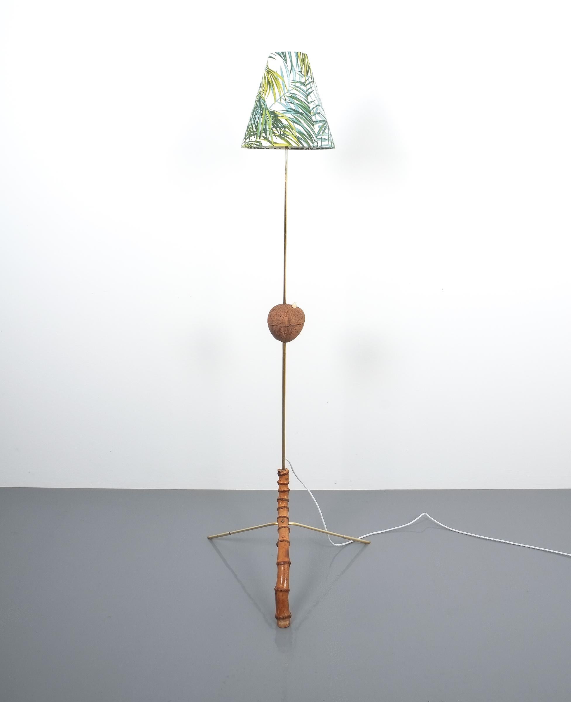 Coconut brass bamboo floor lamp attributed Kalmar, Austria 1950. 

Stylish Austrian modern floor light made from bend bamboo and brass with a coconut switch, the shade has been newly customized. The light has been restored and newly