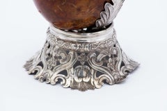 Coconut-shaped mate gourd with a South American cut-out silver stand