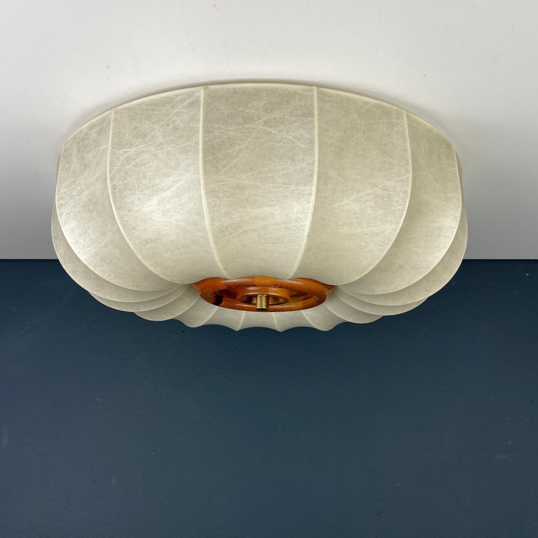 The Cocoon Ceiling Lamp, designed by Friedel Wauer for Goldkant Leuchten in Germany in the 1960s, is a significant example of lighting design from that era. The history of Cocoon lamps is intertwined with the post-war revival of design and