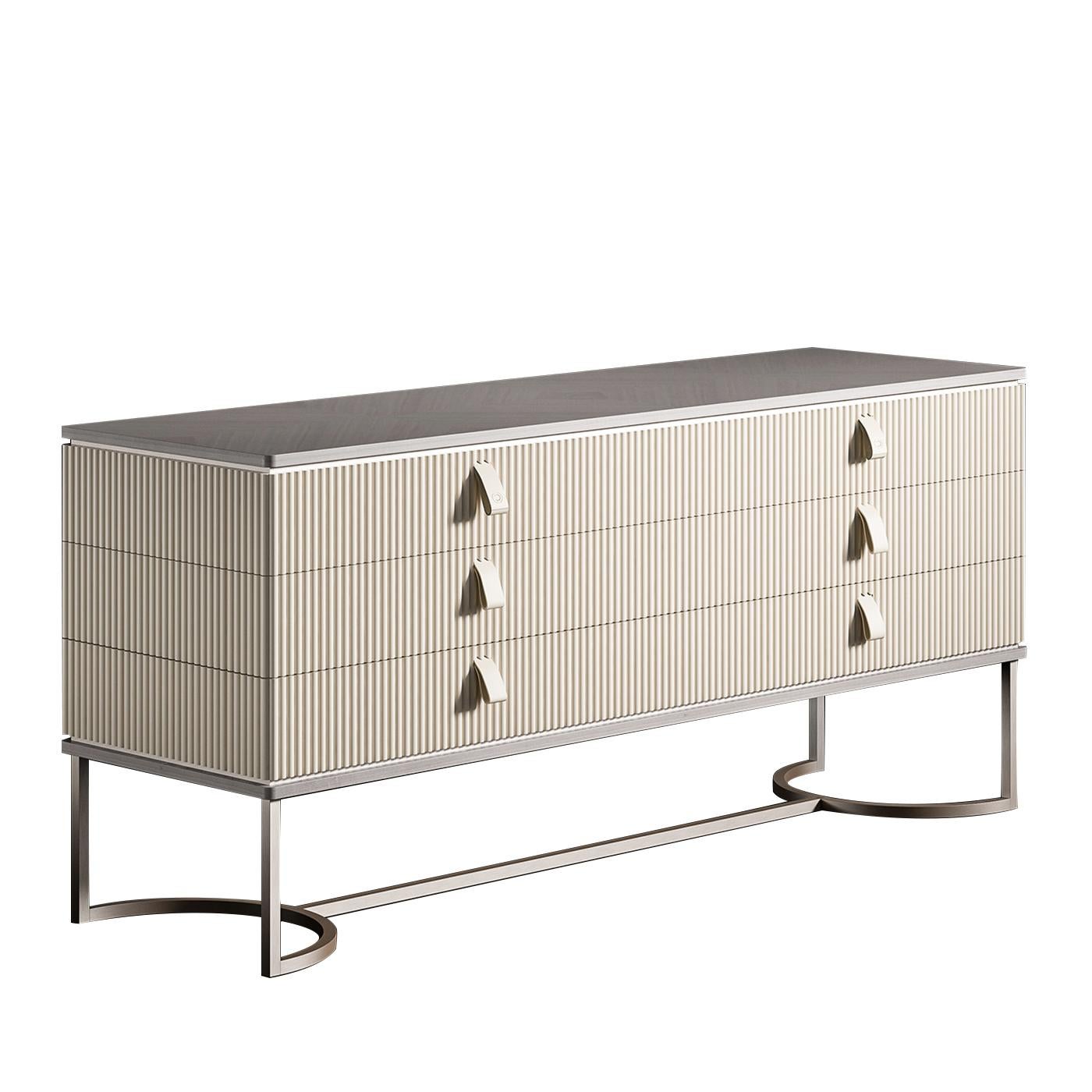 A classical Silhouette with a modern twist, this elegant dresser is a testament to Cipriani's expert craftsmanship and creativity. The metal base is composed of two semi-circular sides connected at the center by a straight bar with a matte gray