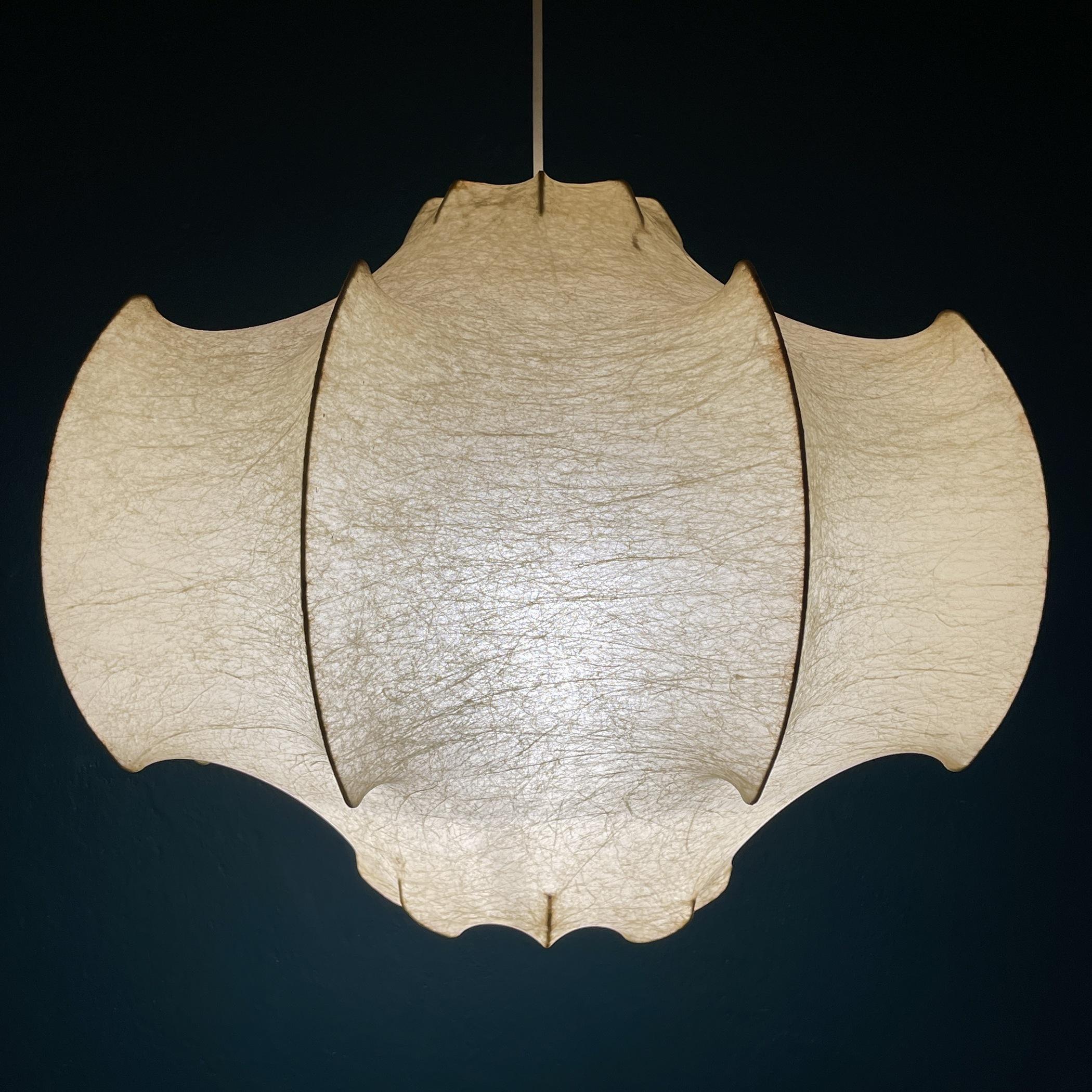 The rare mid-century pendant lamp Cocoon Viscontea by Achille Castiglioni for Flos was made in Italy in the 1960s. One of the most known and gorgeous of the Coccon lamps - Viscontea. The structure of the lamp is covered using a highly innovative
