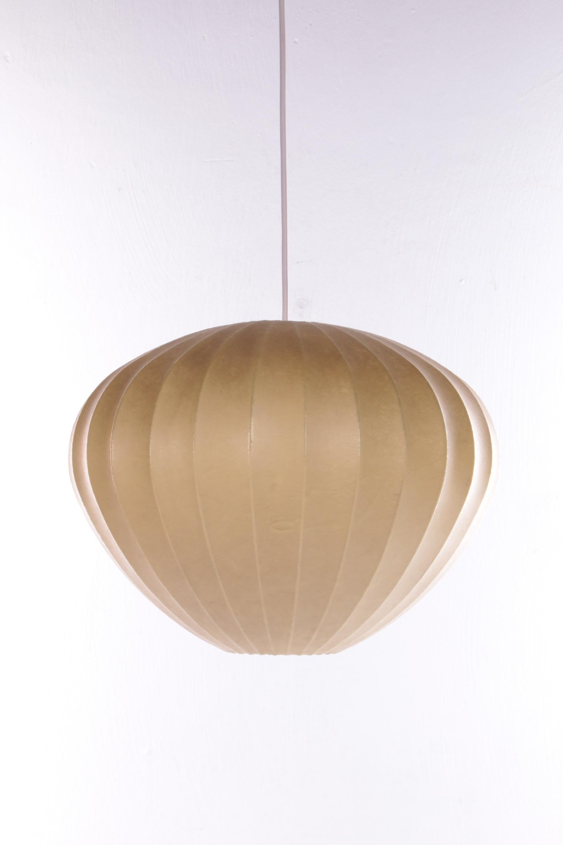 Cocoon pendant lamp by Achille Castiglioni for Flos

This is a beautiful bulb lamp or
Cocoon pendant lamp by A.C. for Flos
The main feature of this iconic pendant lamp by architect C. is the new material used to make it. The frame is metal