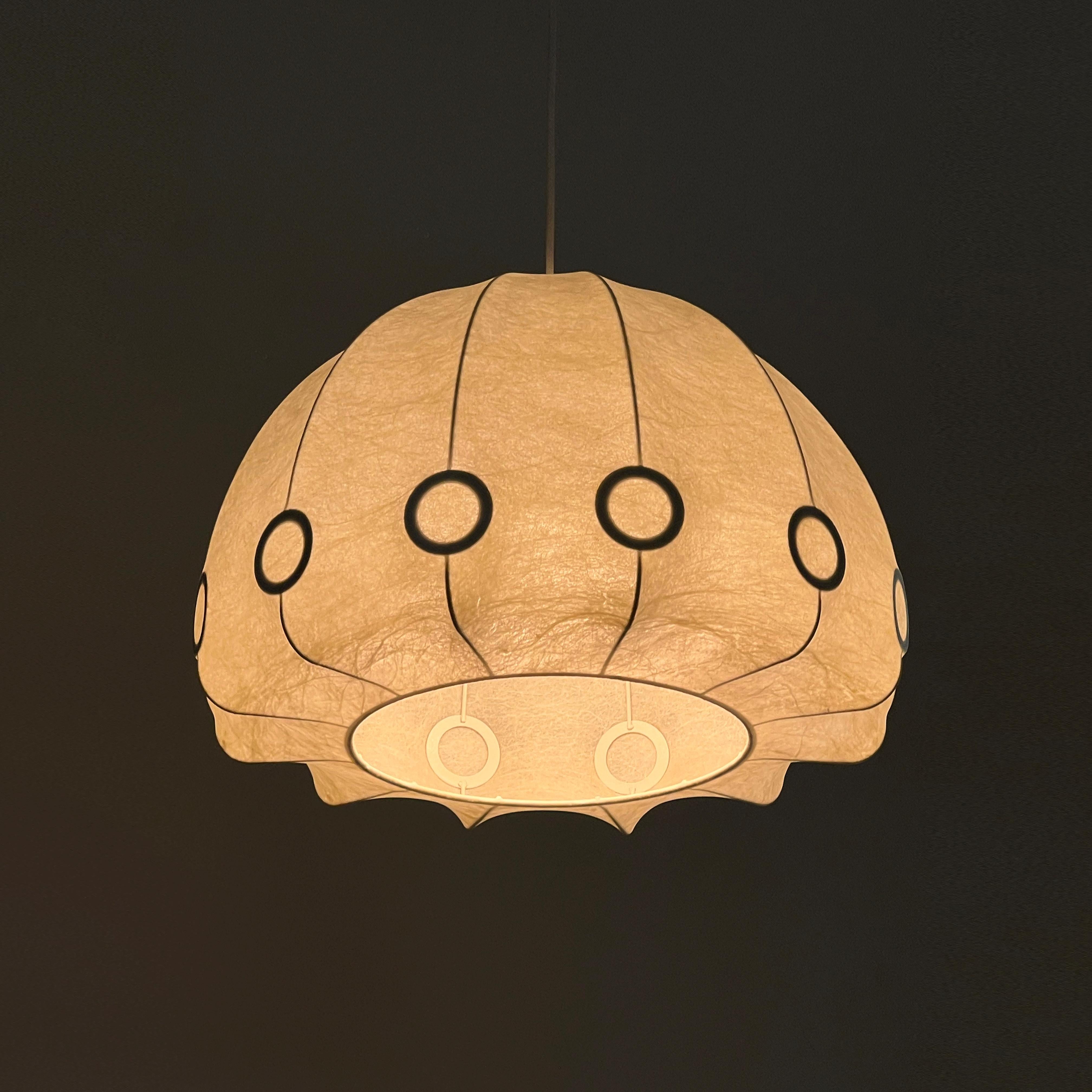 Cocoon pendant light designed by Friedel Wauver for Goldkant Leuchten, Germany 1960s

One of the most remarkable aspects of this piece is its ability to transcend the boundaries of time and style. Despite being born in the 1960s, it feels as