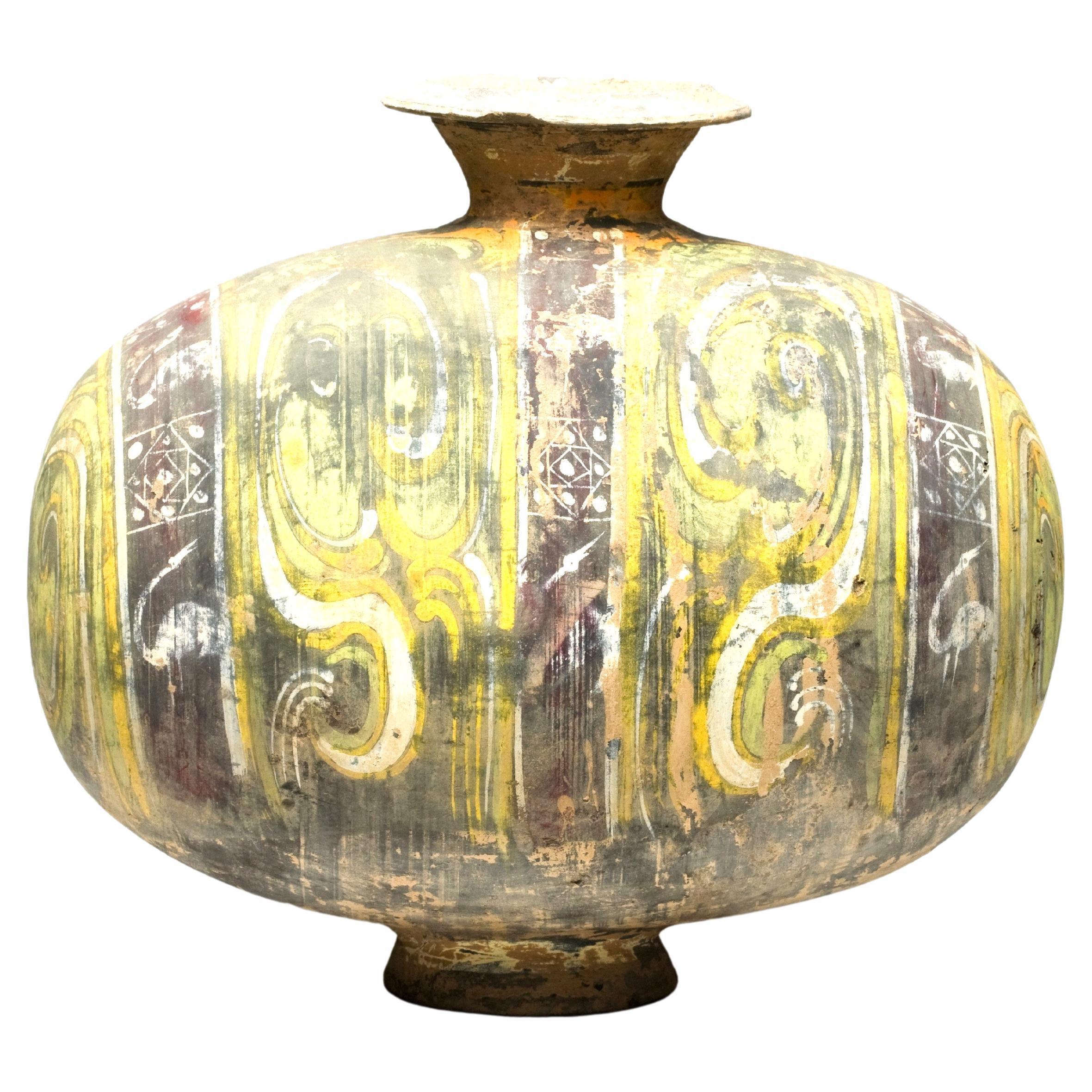 Cocoon-shaped earthenware jar with cloud-scroll design, West Han Dynasty For Sale