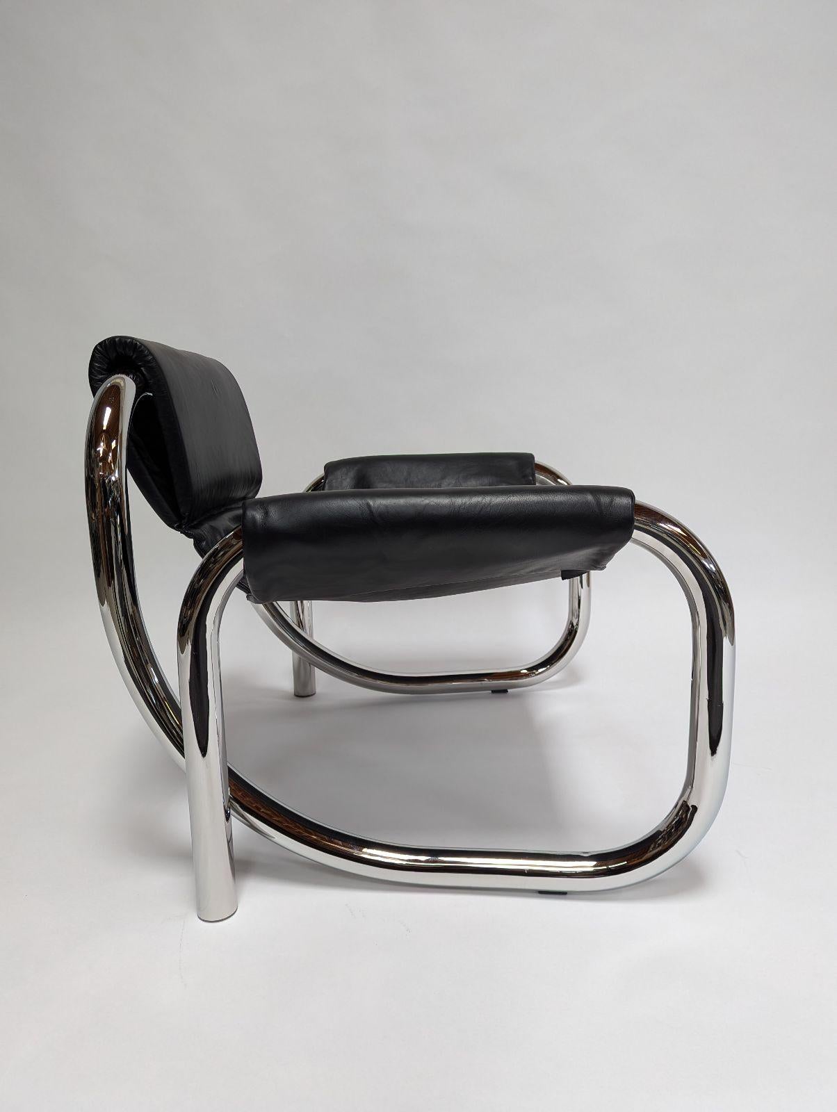 The Coda lounge chair is a study of material, form and emotion. The contrast of the cushioned leather sling and the continuous polished chrome frame, evokes cinematic drama and 70's art deco revival. It is offered in polished chrome with responsibly