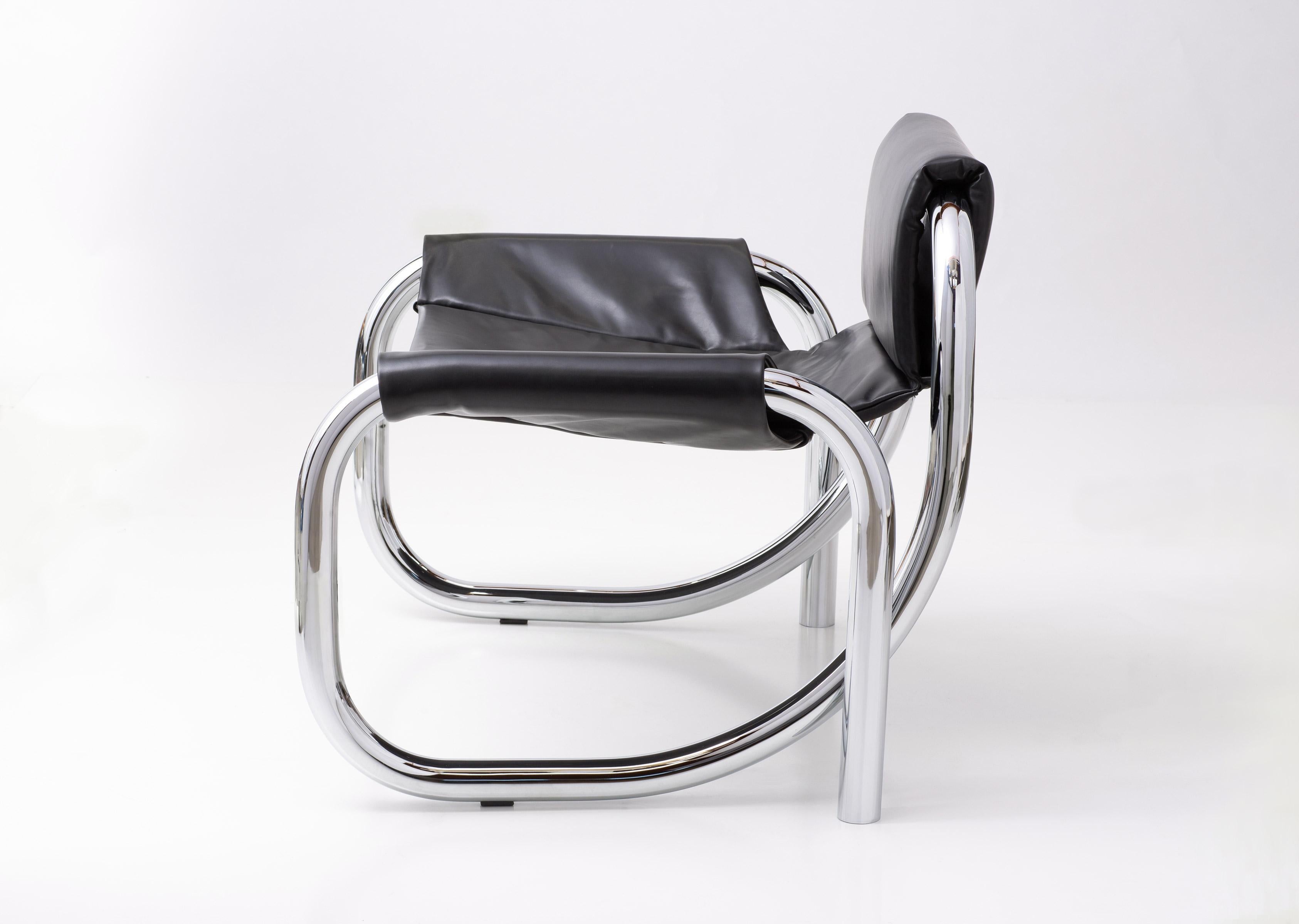 The Coda lounge chair is a study of Material, form and emotion. The contrast of the cushioned leather sling and the continuous polished chrome frame, evokes cinematic drama and 70s Art Deco revival. It is offered in polished chrome with responsibly