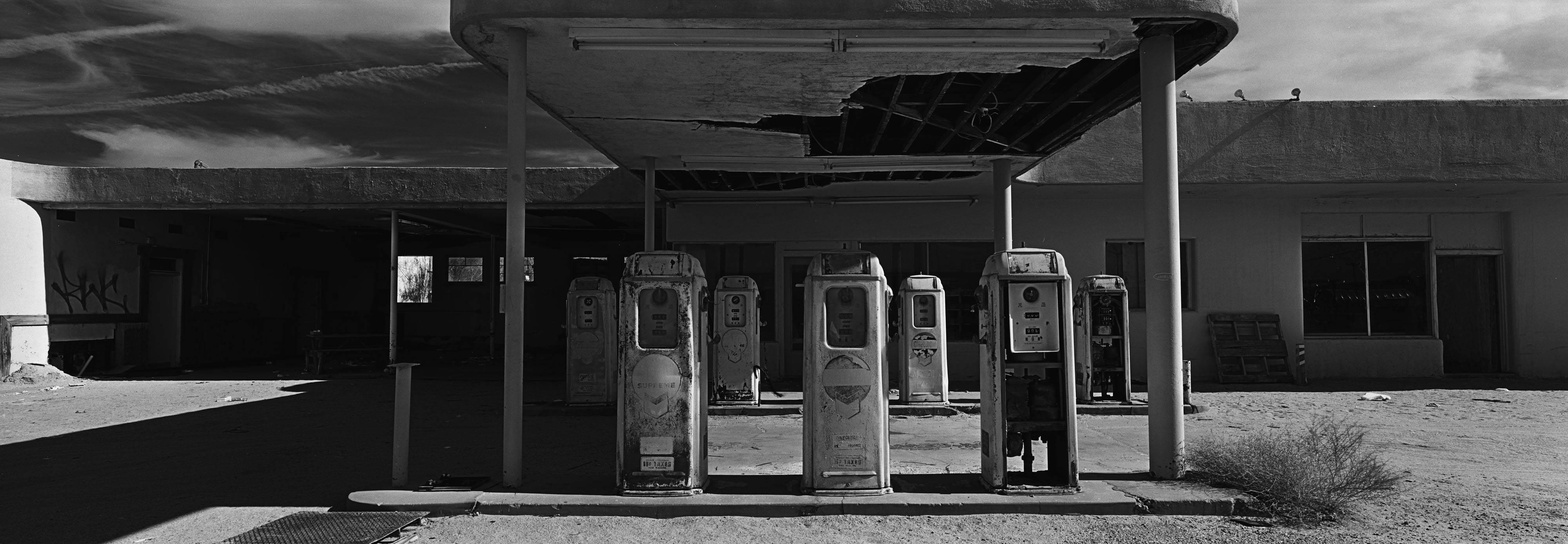 Cody S. Brothers Black and White Photograph - Landscape Photography Panoramic Series: 'Gas Pumps'