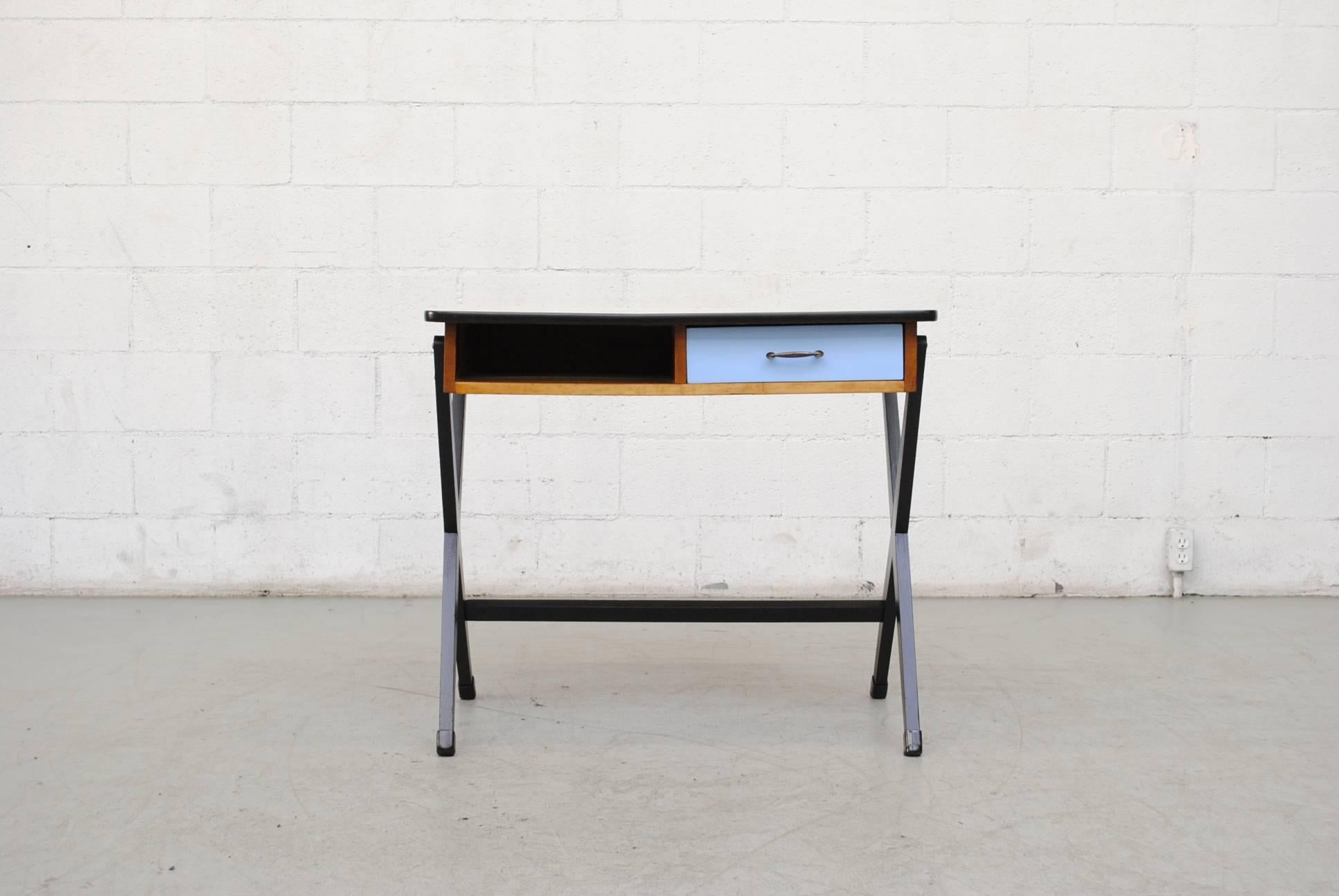 Little writing desk in birch with ebonized X-base, baby blue colored drawer and formica top. Coen de Vries is among the Dutch pioneers of industrial design Many of Coen de Vries practical designs where recommended by Goed Wonen (Good Living) a Dutch