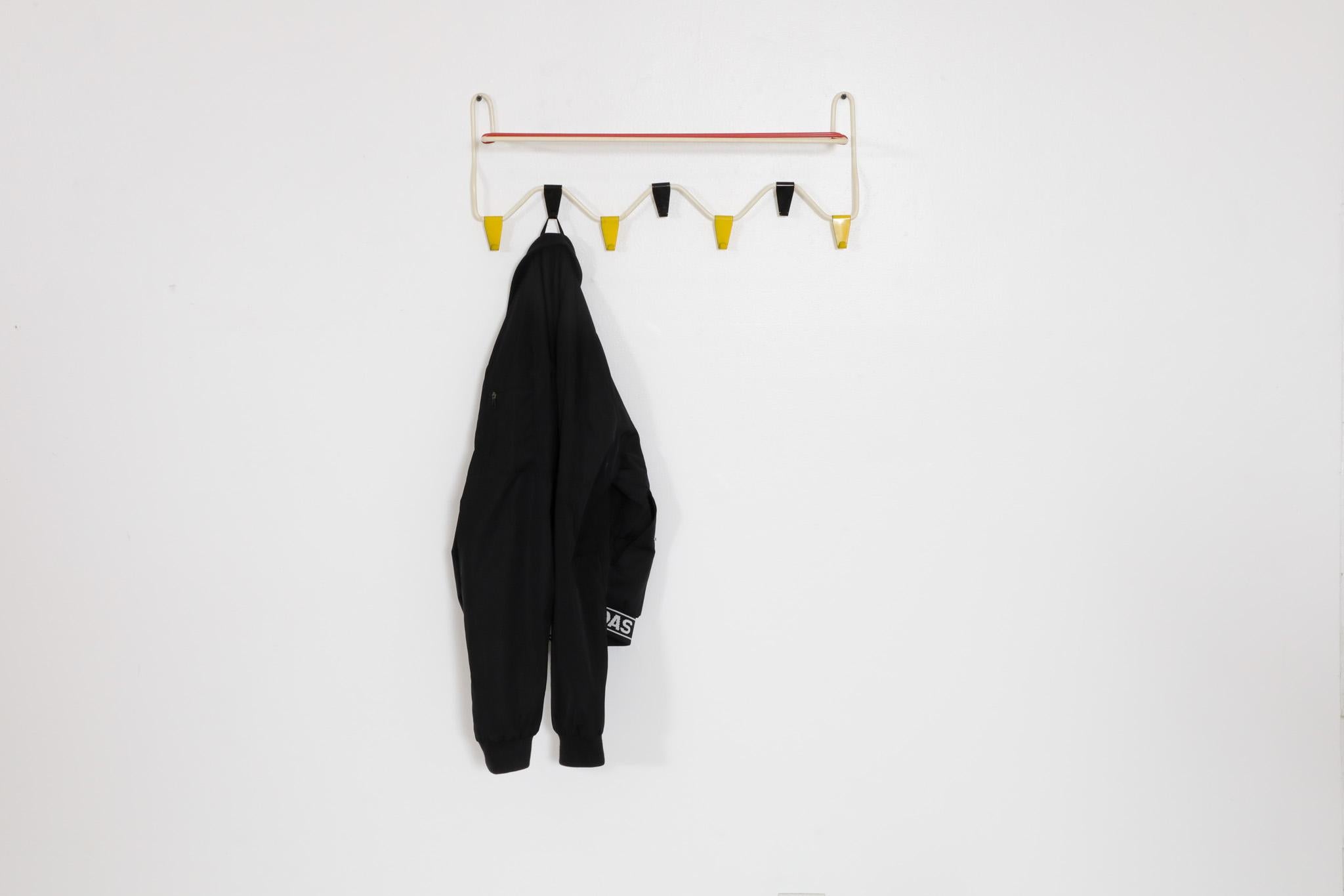 Cute wire coat rack by Coen de Vries for Pilastro. Pilastro was an Amsterdam company that proudly bore the Good Housing Quality Mark, an award given out by the publication of the 