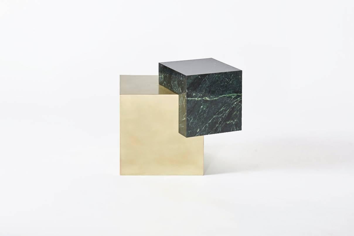 You can now give your room a sophisticated appeal, with this Coexist Askew furniture. This side table is made from Empress Green marble cube and brushed brass cube.It has a state-of-art design, which enhances the ambiance in any room. Besides its
