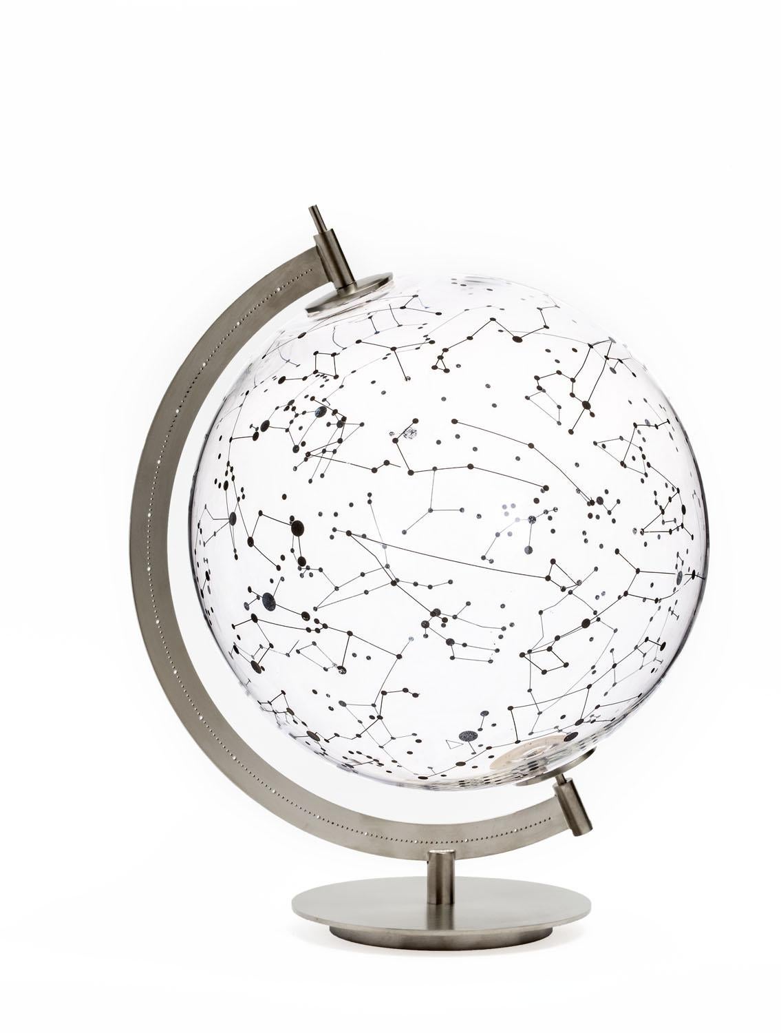 Gio Tirotto realizes the project coexist: the Ground globe and the Sky stellar map, two objects complementary as only Sky and Earth can be, where the transparent glass allows to look to the world and the stars in their entirety, overlapping far