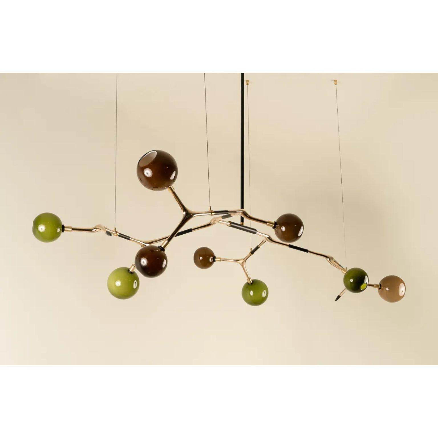 Coffee and Olive with Polished Bronze Mantis 9 Pendant Lamp by Isabel Moncada
Dimensions: D 100 x W 190 x H 110 cm.
Materials: Cast bronze, blown glass and turned brass.

Mantis 9, discreet and elegant with measured dimensions. For a medium and