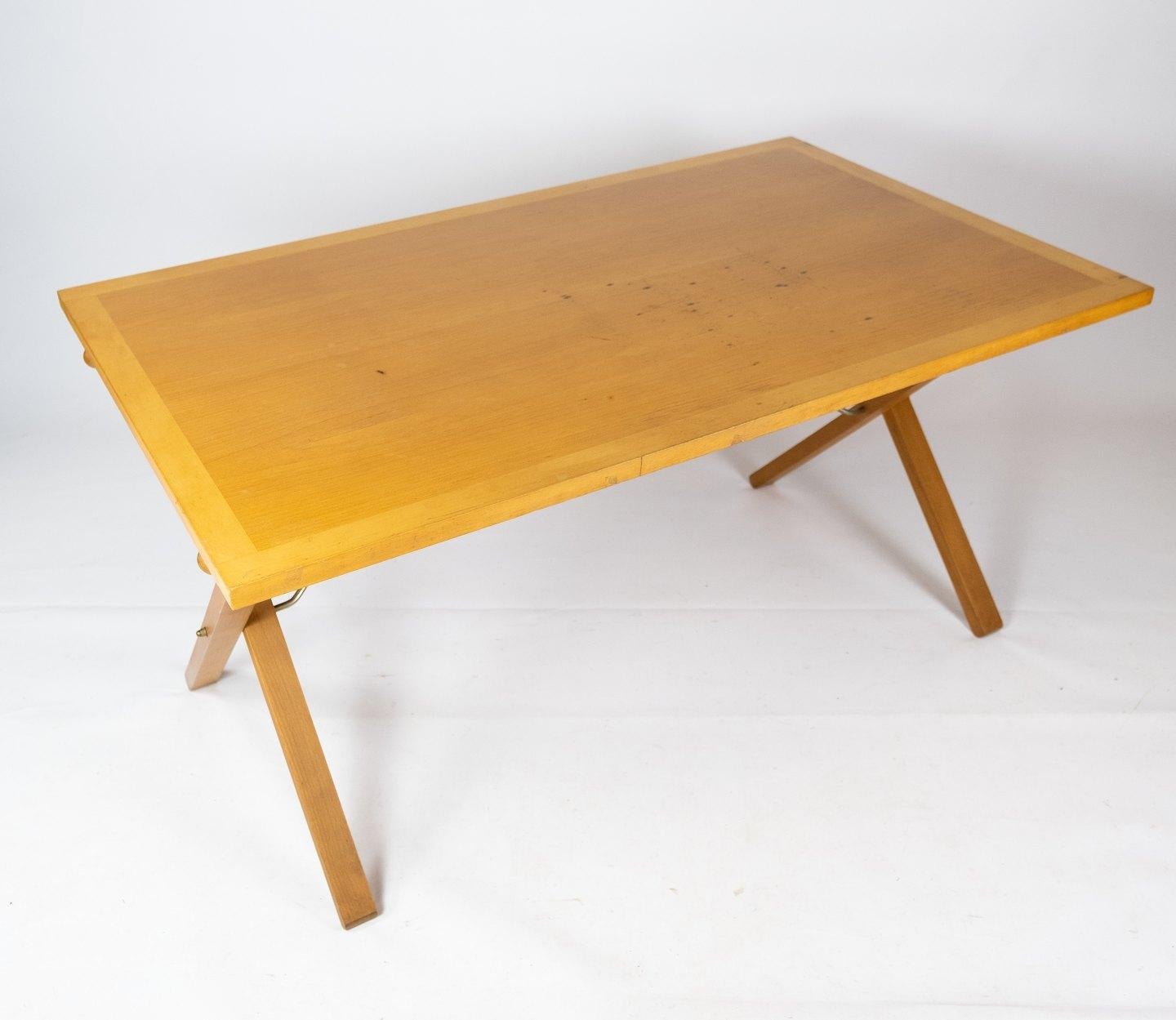 This dining table is a true gem of Danish furniture design and clearly bears the stamp of Paul Cadovius' unique vision and talent. Manufactured by the renowned company Cado in the 1960s, this table represents the best in Danish craftsmanship and