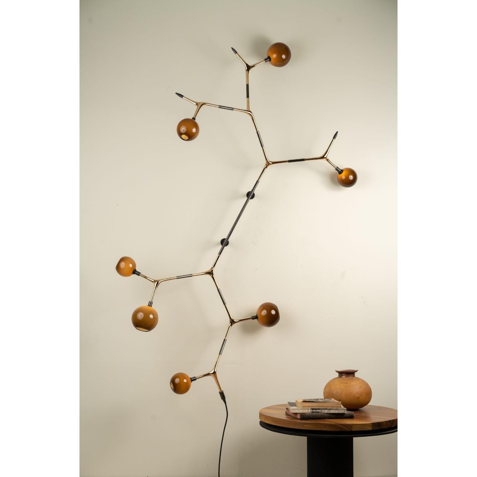 Coffee and Polished Bronze Campamocha Climbing Wall Lamp by Isabel Moncada
Dimensions: D 50 x W 130 x H 220 cm.
Materials: Cast bronze, blown glass and turned brass.
Weight: 10.5 kg.

Campamocha is a wall climbing lamp, just like the insect it is