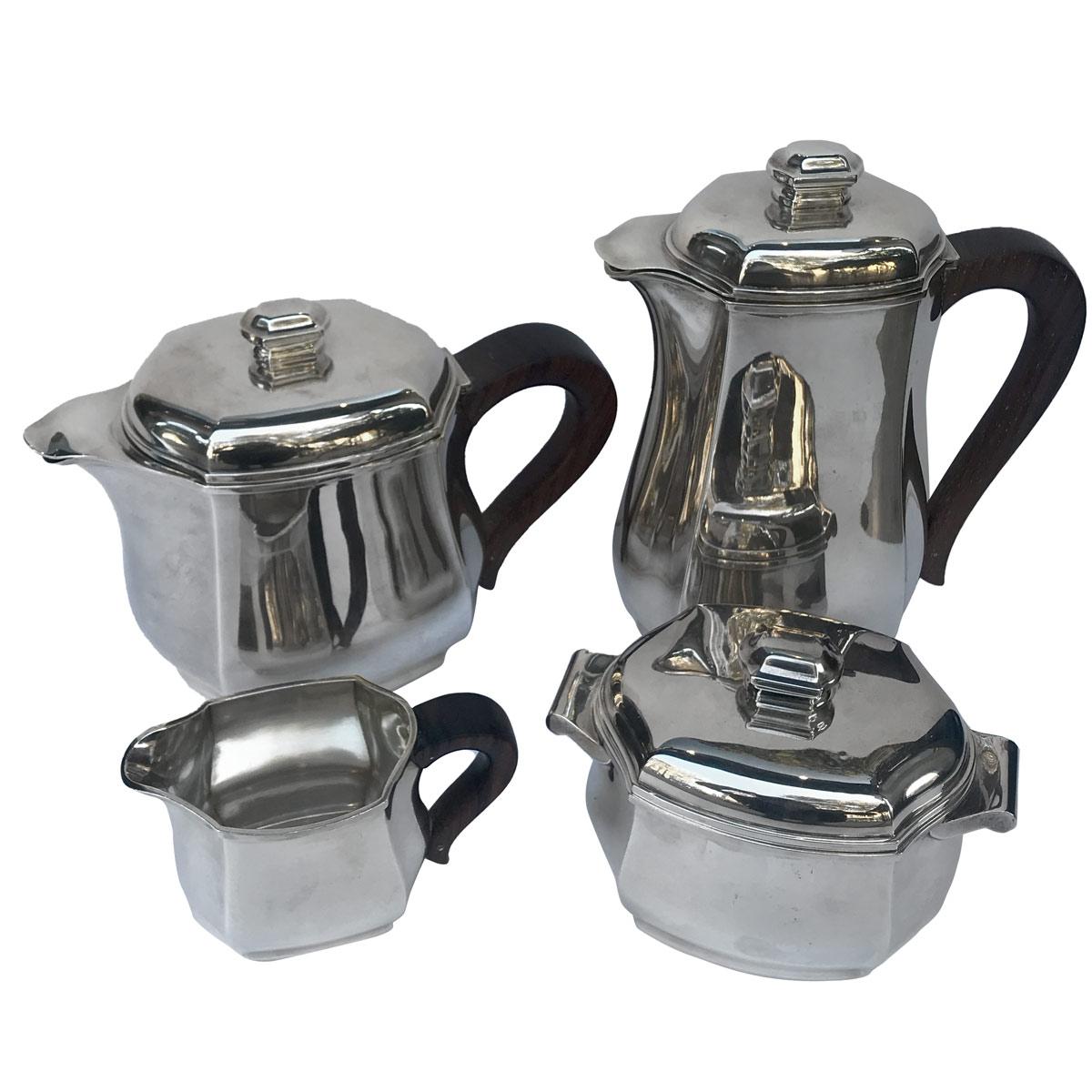 Art Déco style silver coffee and tea set composed of 4 pieces: one teapot, one coffeepot, one sugar bowl, and a milk jug. Silver decorated with pinched ribs decoration and flat areas. French Minerve silver mark, silversmith mark and each piece is