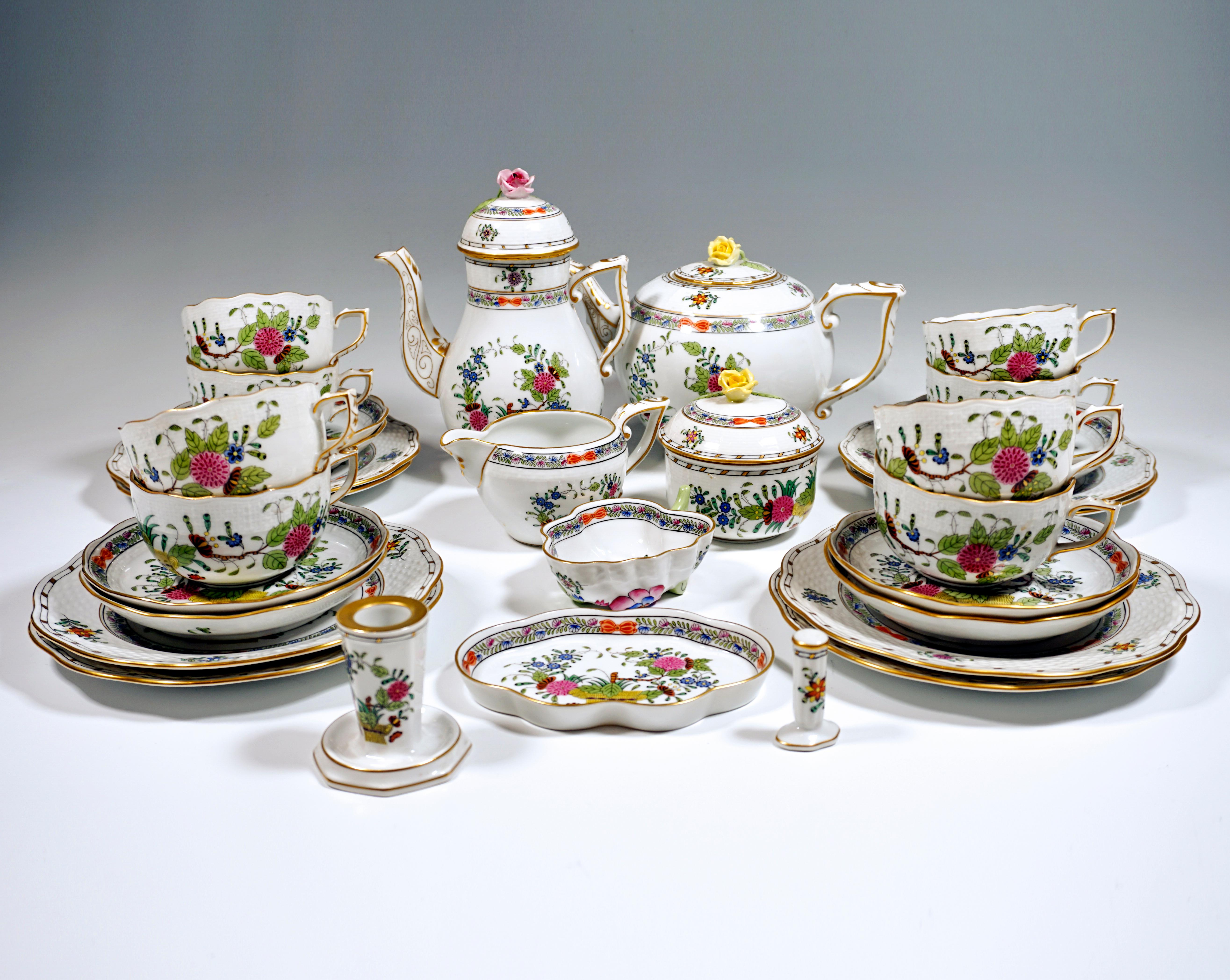 Herend service consisting of 32 parts: coffee pot with lid, teapot with lid, milk jug, sugar bowl, eight cups, eight saucers, eight dessert plates, a candle holder, a candy bowl, an ashtray and a cigarette steamer.
Shape: Osier / basket