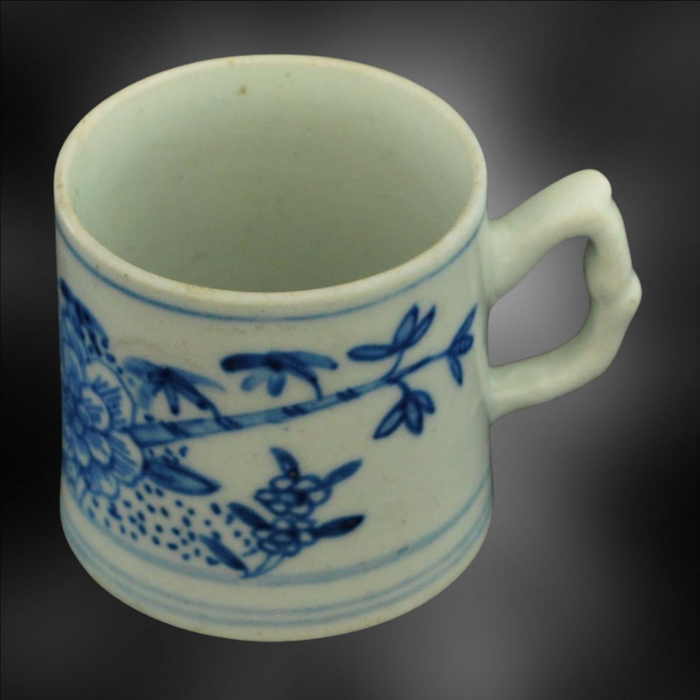An early coffee can, painted in under-glaze blue with peonies and bamboo. The painting links with the William Pether 1754 jug.

The decoration is taken directly from Chinese examples, and was intended to compete with Chinese imports. 

Peonies