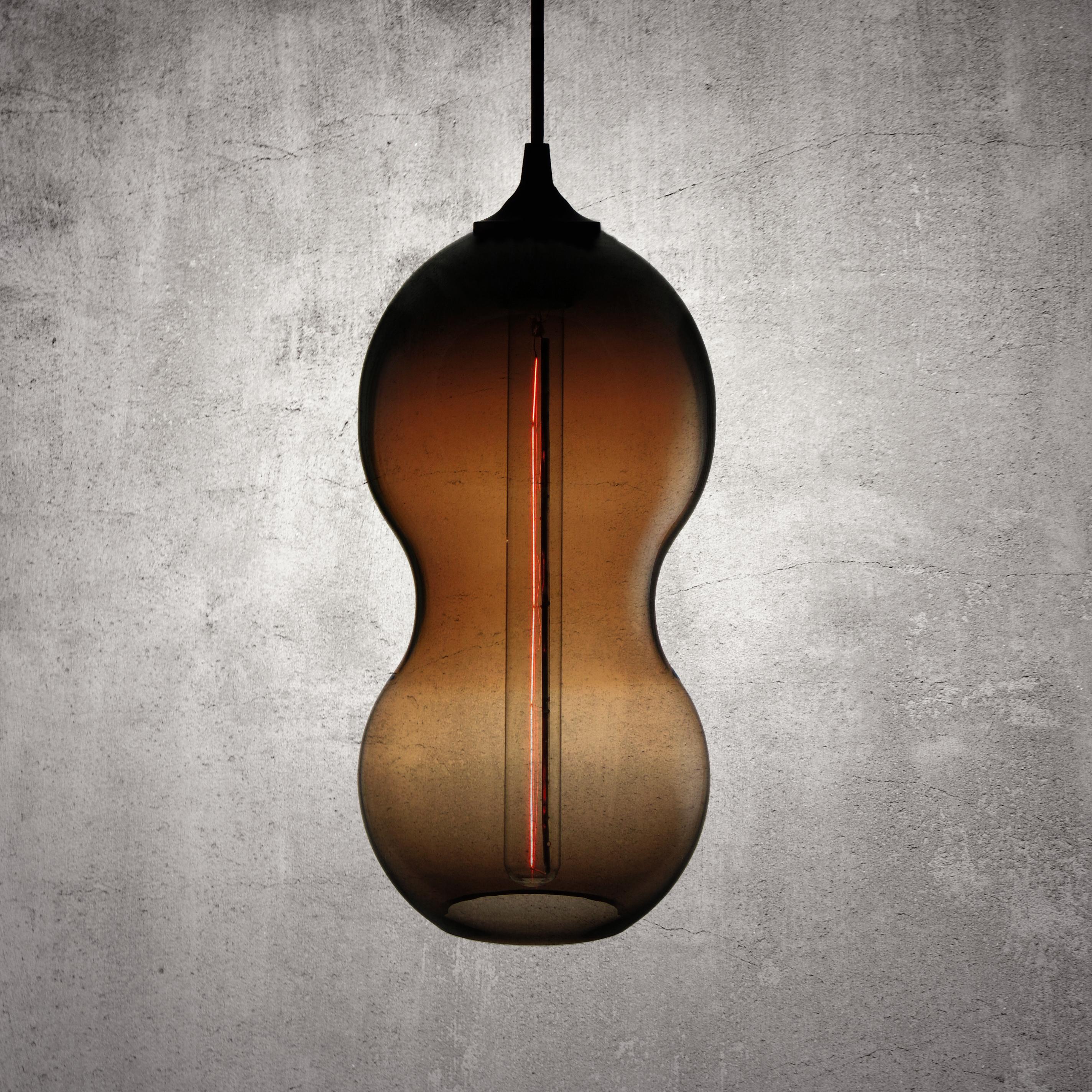 The form of the pod is universal as is the seed, distinctive and familiar - subtle and curvaceous, softly complementing its surrounds. This was exactly our intention when creating the Cacahuate lamp. We wanted a form that complimented rather than