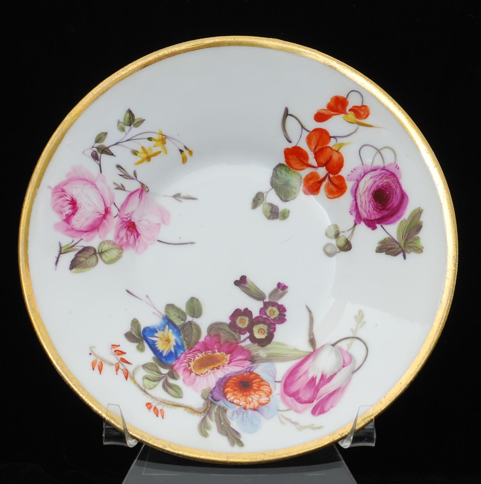 A rare coffee cup and saucer in Nantgarw’s superb soft-paste porcelain. Each piece is gilded and decorated in one of the London workshops with superb flower painting, probably by Moses Webster.

The Nantgarw factory lasted only a few years, but