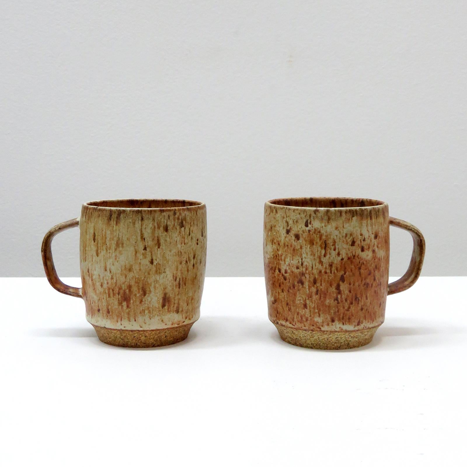 wonderful 'Carmel' coffee cups, handcrafted by Los Angeles based ceramicist Jed Farlow. High fired stoneware with matte 'toasted orange' glaze. Designed with a human-centered approach in mind, these stackable mugs are thoughtfully detailed to make a