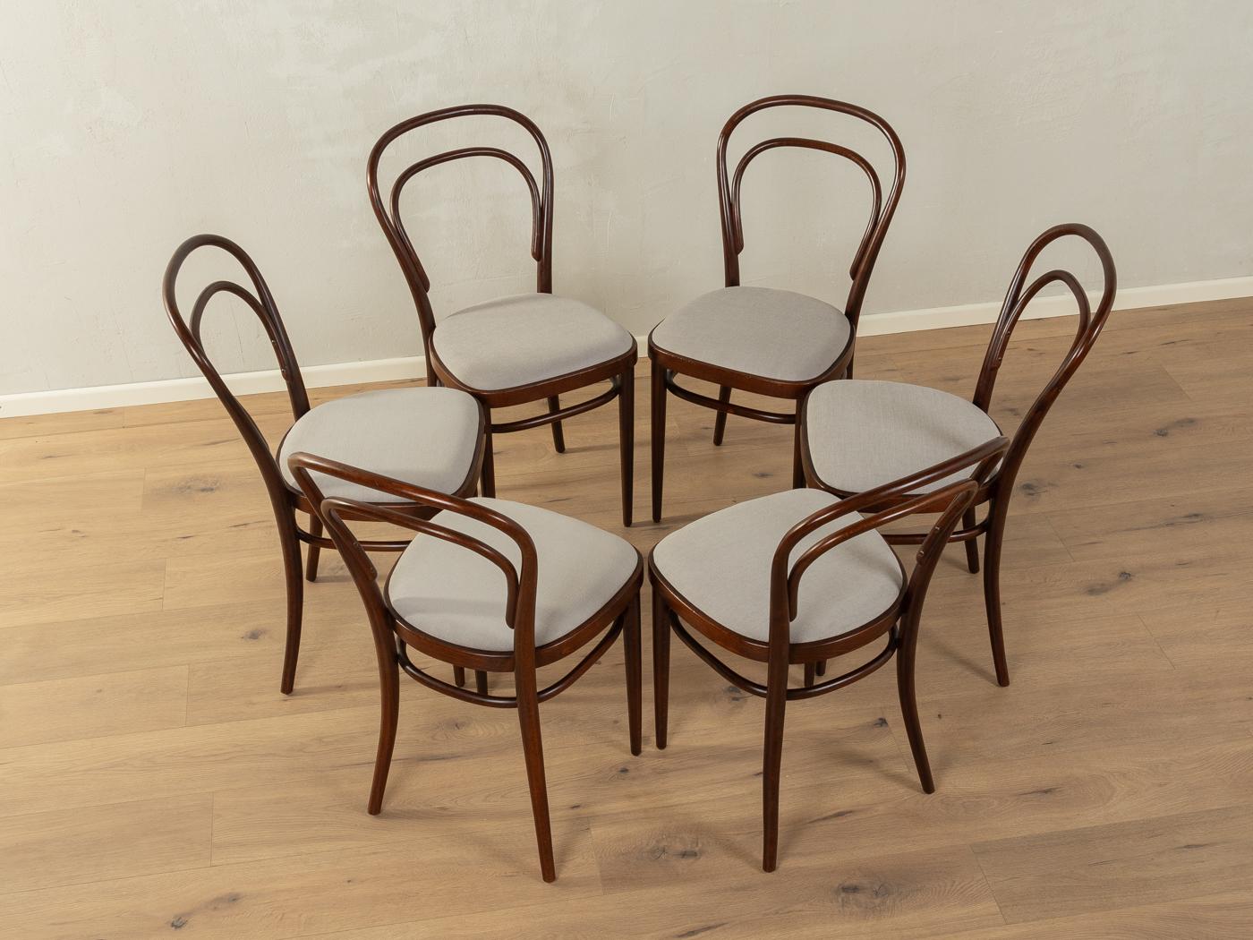 Classic coffee house chair set, model 214, designed by Michael Thonet in the year 1859. The present label from manufacturer Thonet indicates the production series 1922-1938. The chairs have been reupholstered and covered with a high-quality fabric
