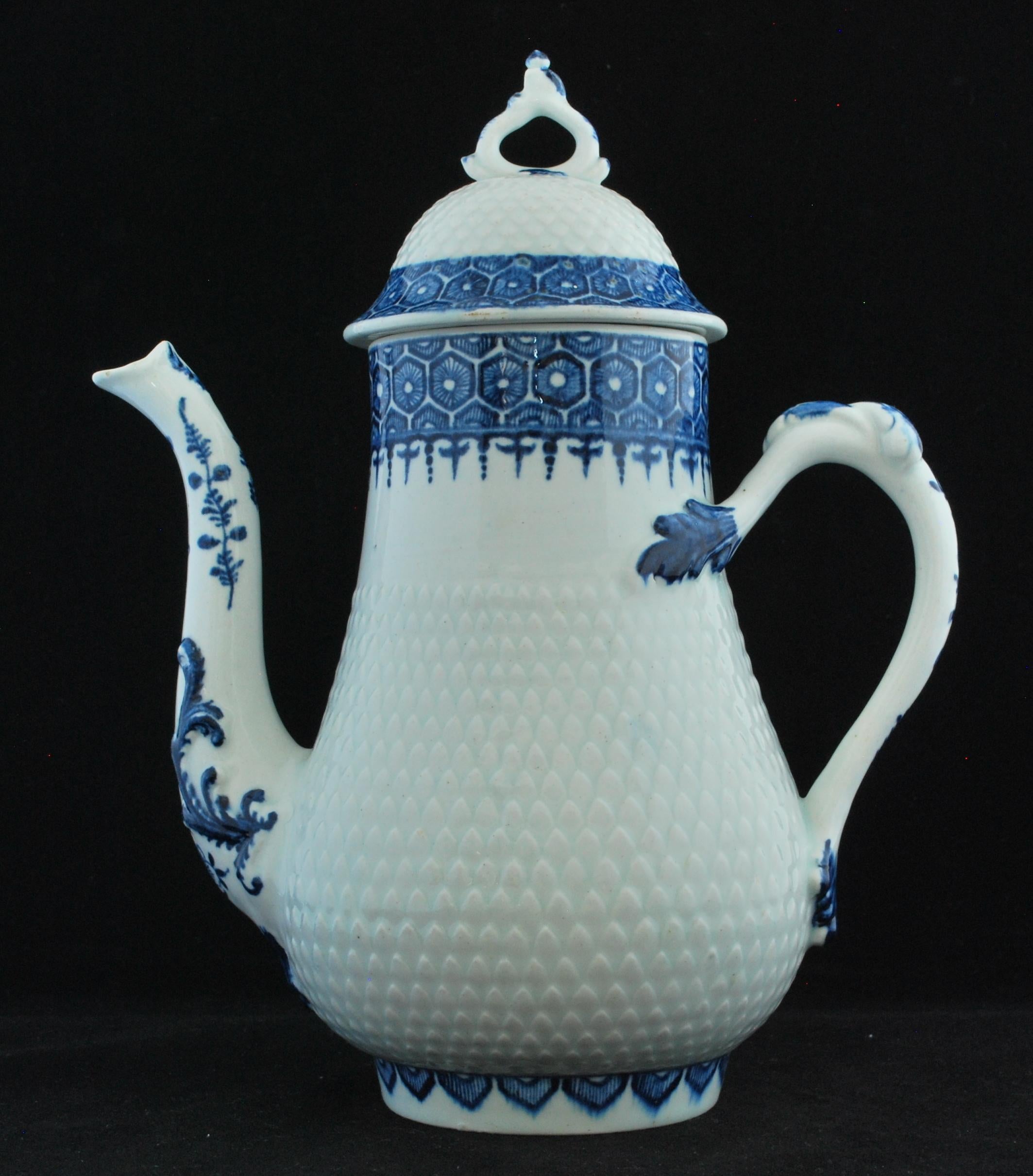 Coffee pot, circa 1765-69: Coffee pot and cover of silver form with domed cover; the body of the pot and dome of the cover pineapple moulded between rims painted in blue with cell and diaper borders; the spout of curving swan-mouth form moulded with