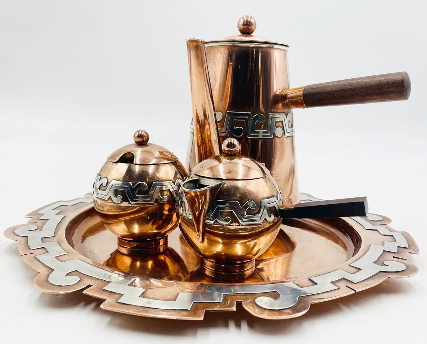 Introducing the remarkable Copper & Silver Coffee/Tea Service by Ana Maria Nunez De Brilanti for Plateria Victoria, Mexico 1960's. Immerse yourself in the rich heritage of Mexican craftsmanship with this exquisite set, meticulously handcrafted to