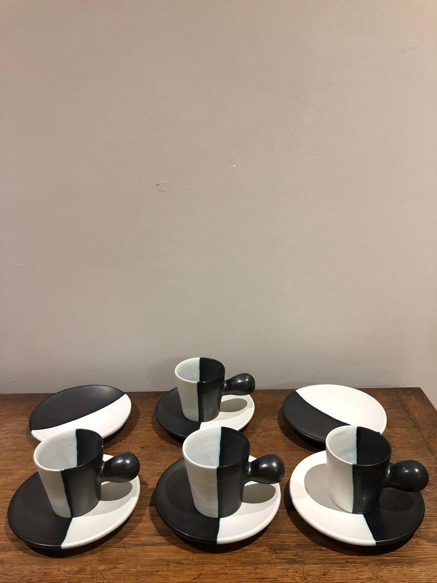 Set of 12 ceramic pieces signed Cerenne Vallauris: 4 cups, 5 plates, one coffee pot, one milk pot and one sugar pot. All original form the 1950s.