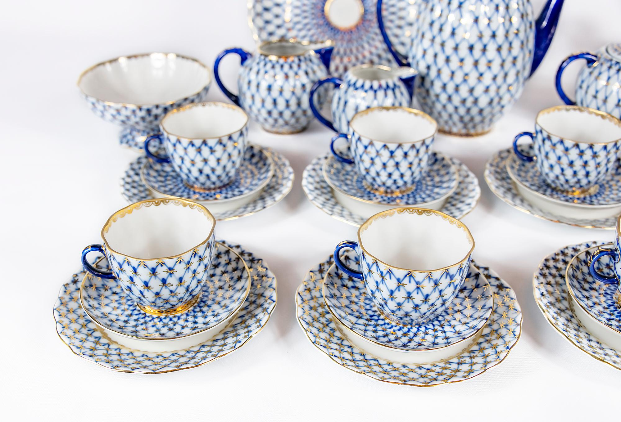 The porcelain set for 8 persons is decorated with cobalt blue/gold net decor handmade by Russian porcelain factory Lomonosov (LFZ).
Marked: 