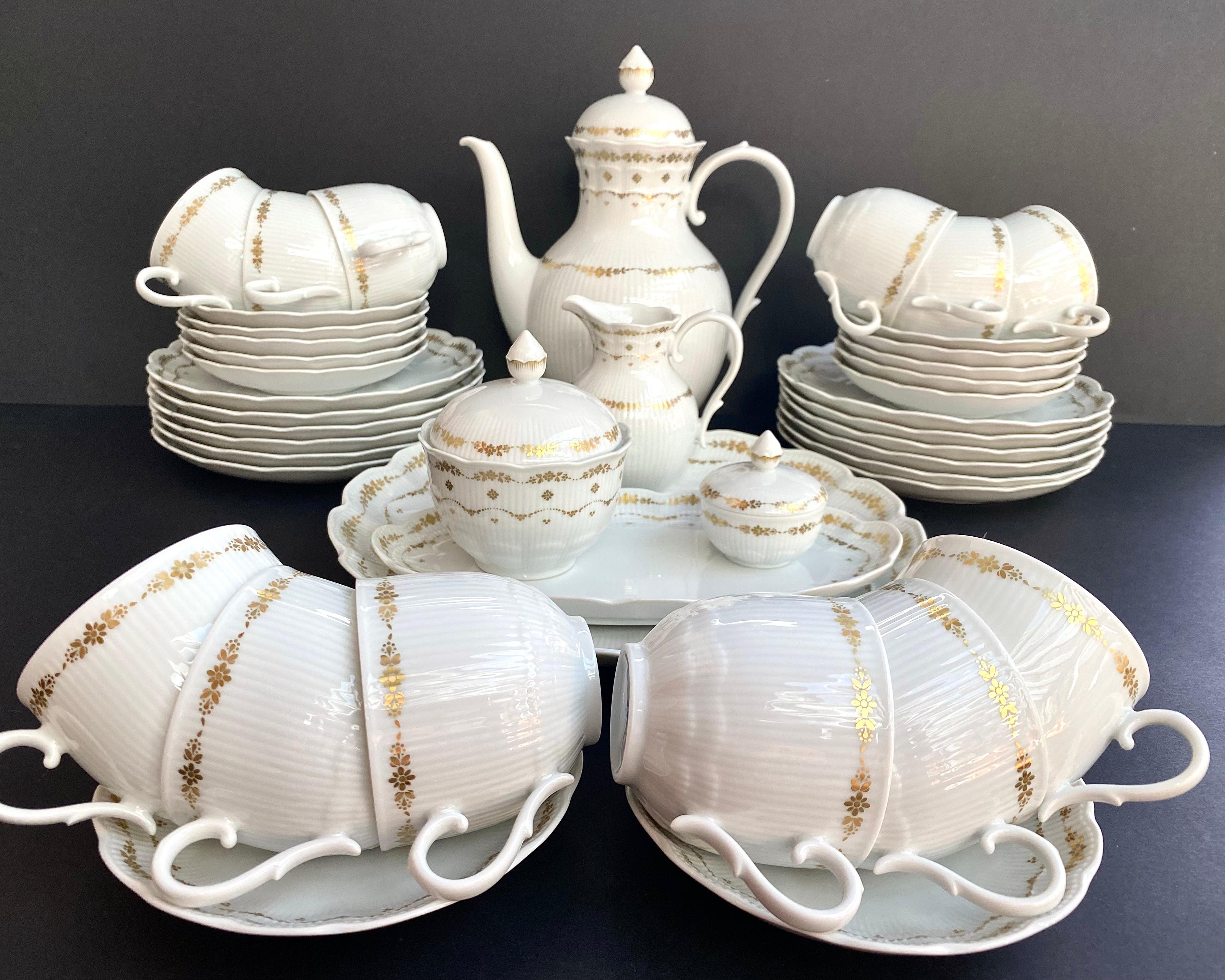 Vintage Coffee service for 12 person, 42 pieces from the famous AK Kaiser manufactory West Germany, 
Romantica Collection, Monte Carlo series, 1970-1980s.

The service made of high quality bone china porcelain.

Gilded underglaze decor.

Each piece
